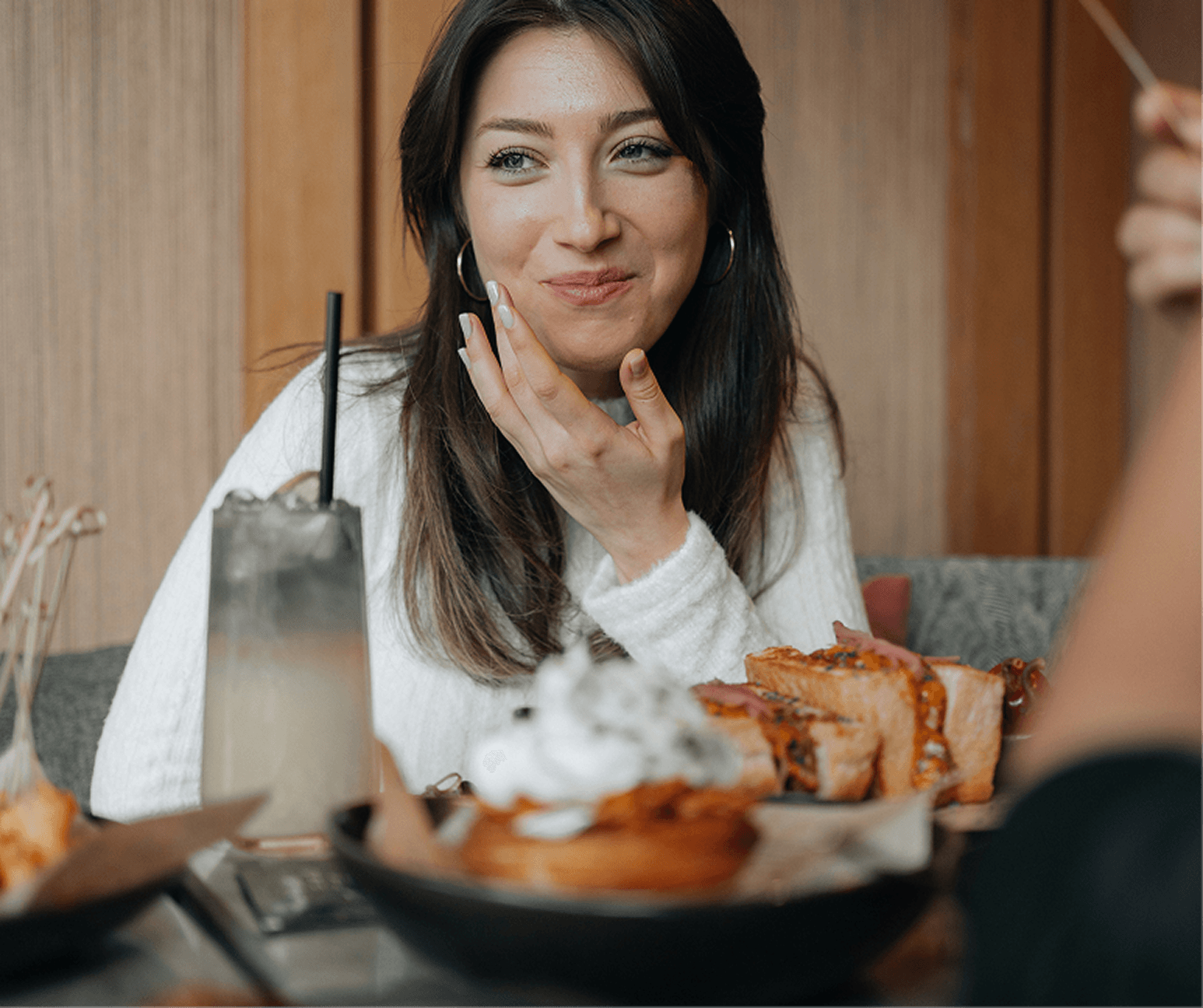 Woman enjoying dinner at a restaurant