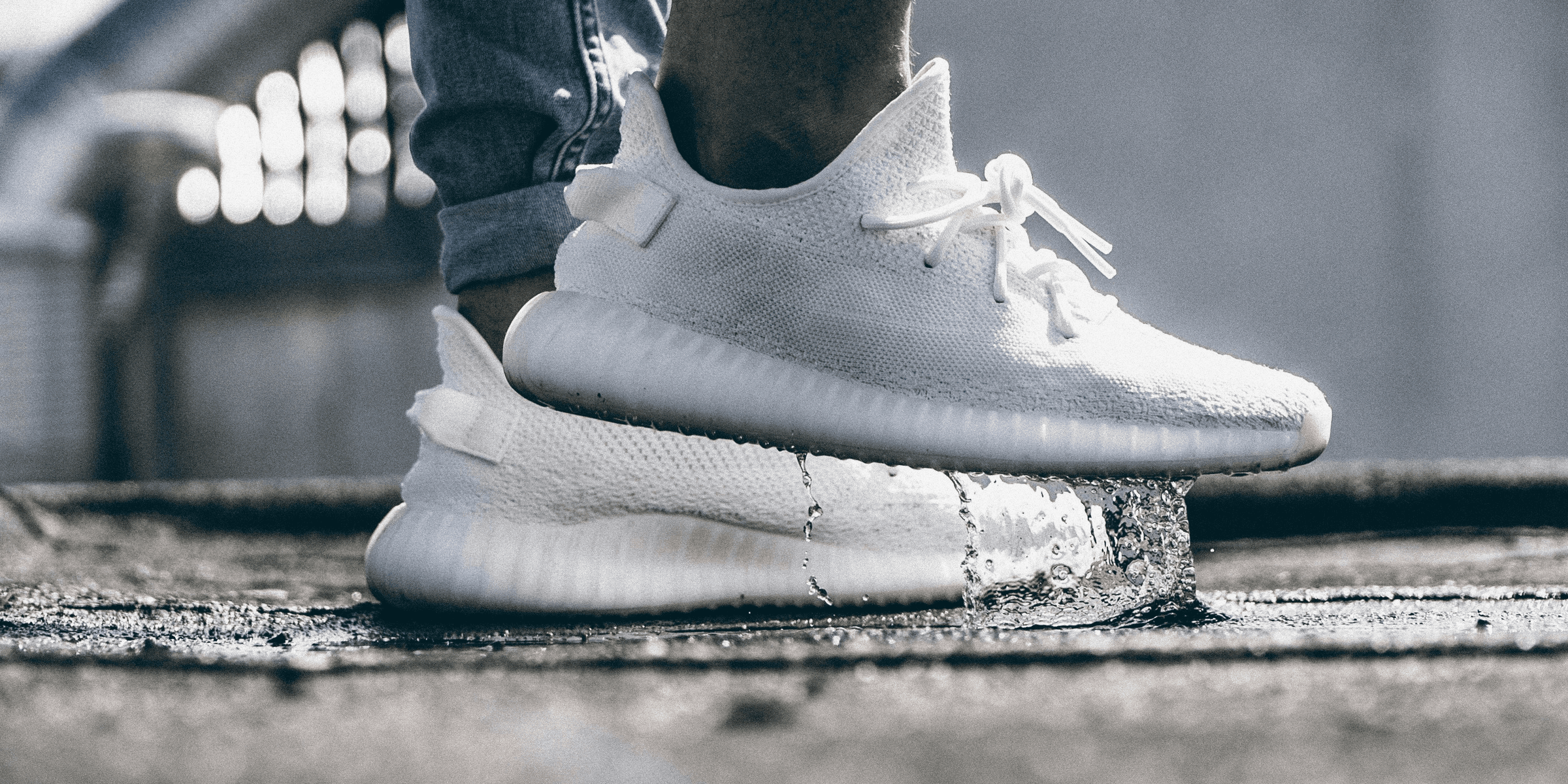 person wearing pair of cream white Adidas Yeezy Boost 350 shoes