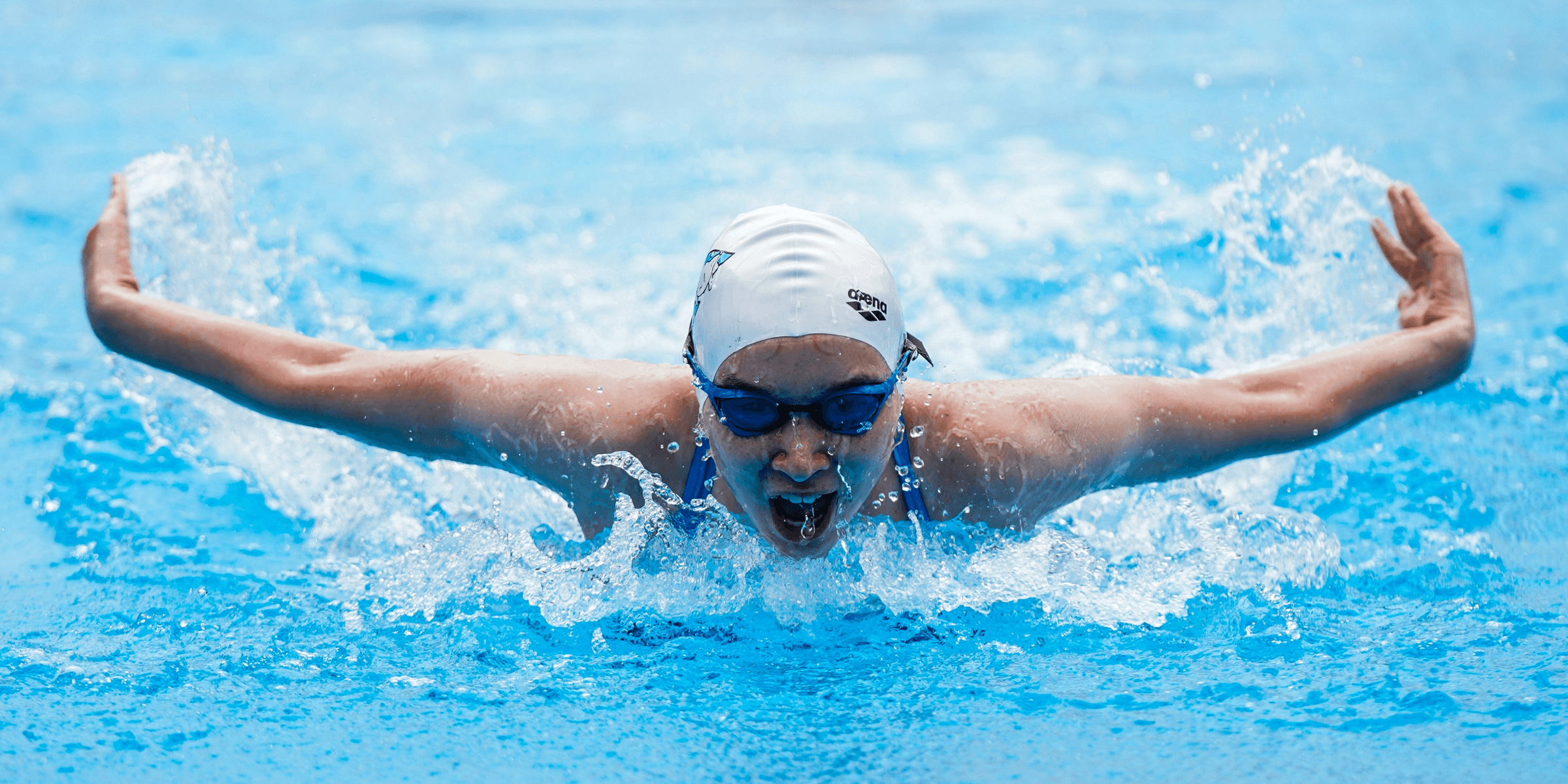 person in swimming goggles in water