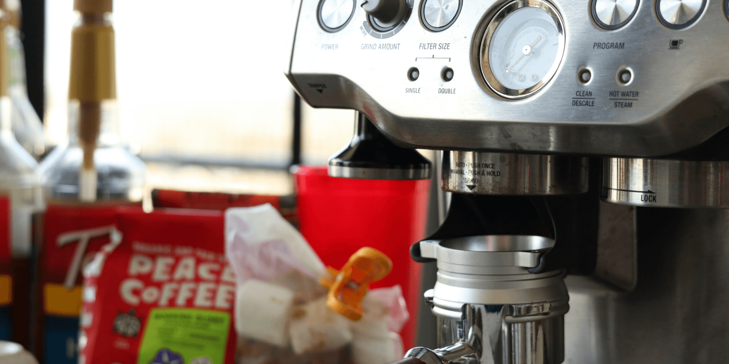 a close up of a coffee maker on a table