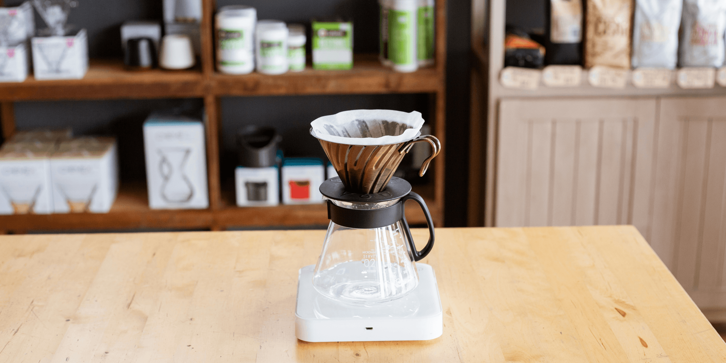 clear glass coffee brewer on desk