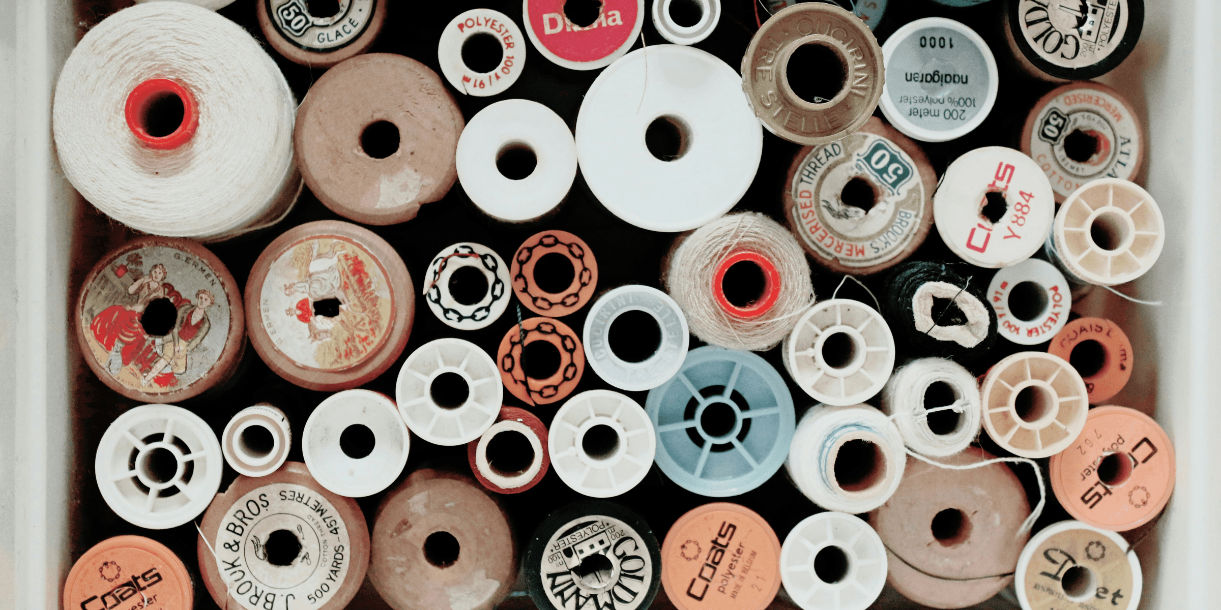 assorted-color threads in white box