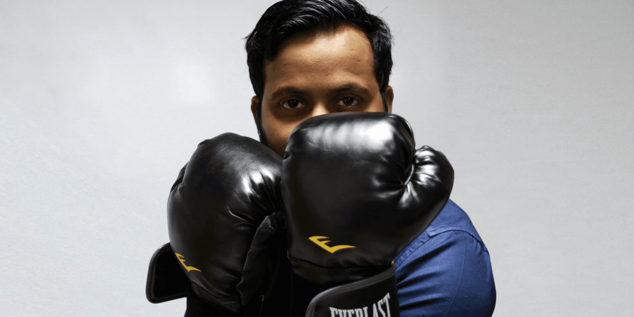 man wearing Everlast boxing gloves