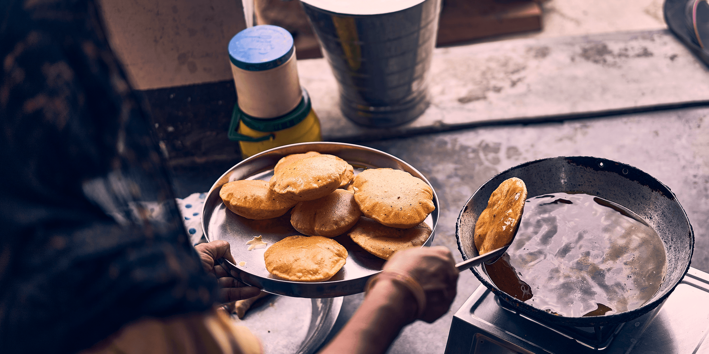 person cooking on black pan.