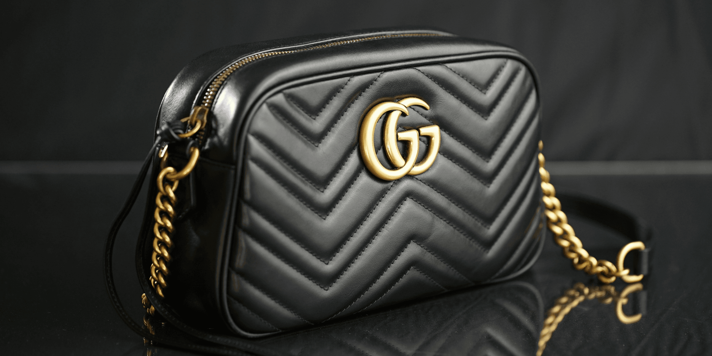black Gucci leather shoulder bag.