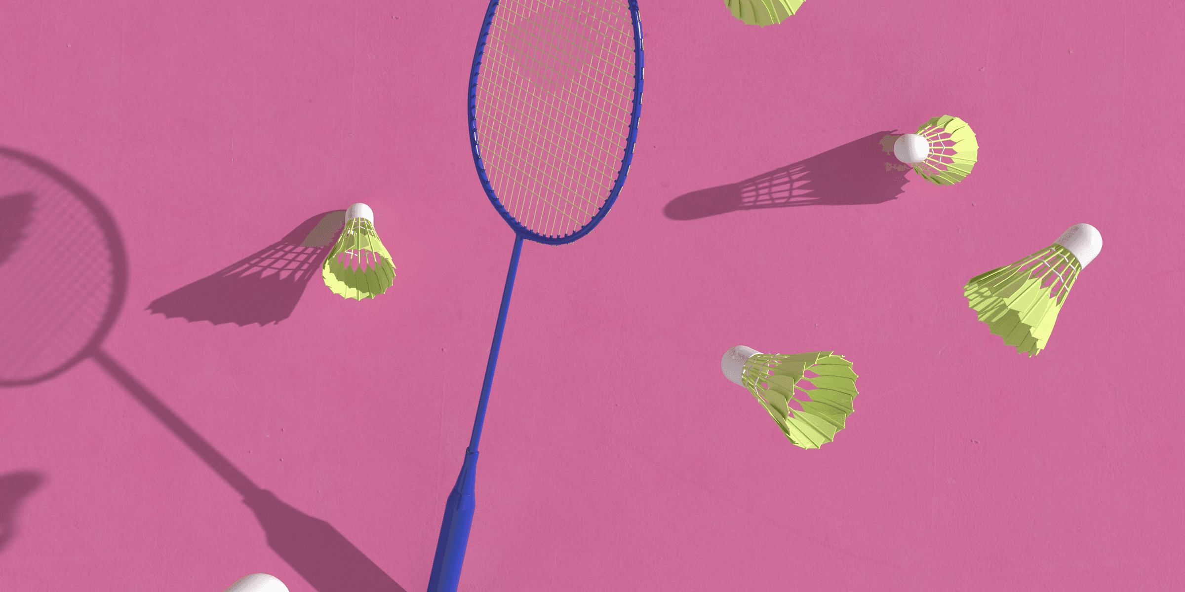 a badminton racket and several badminton balls on a pink background.