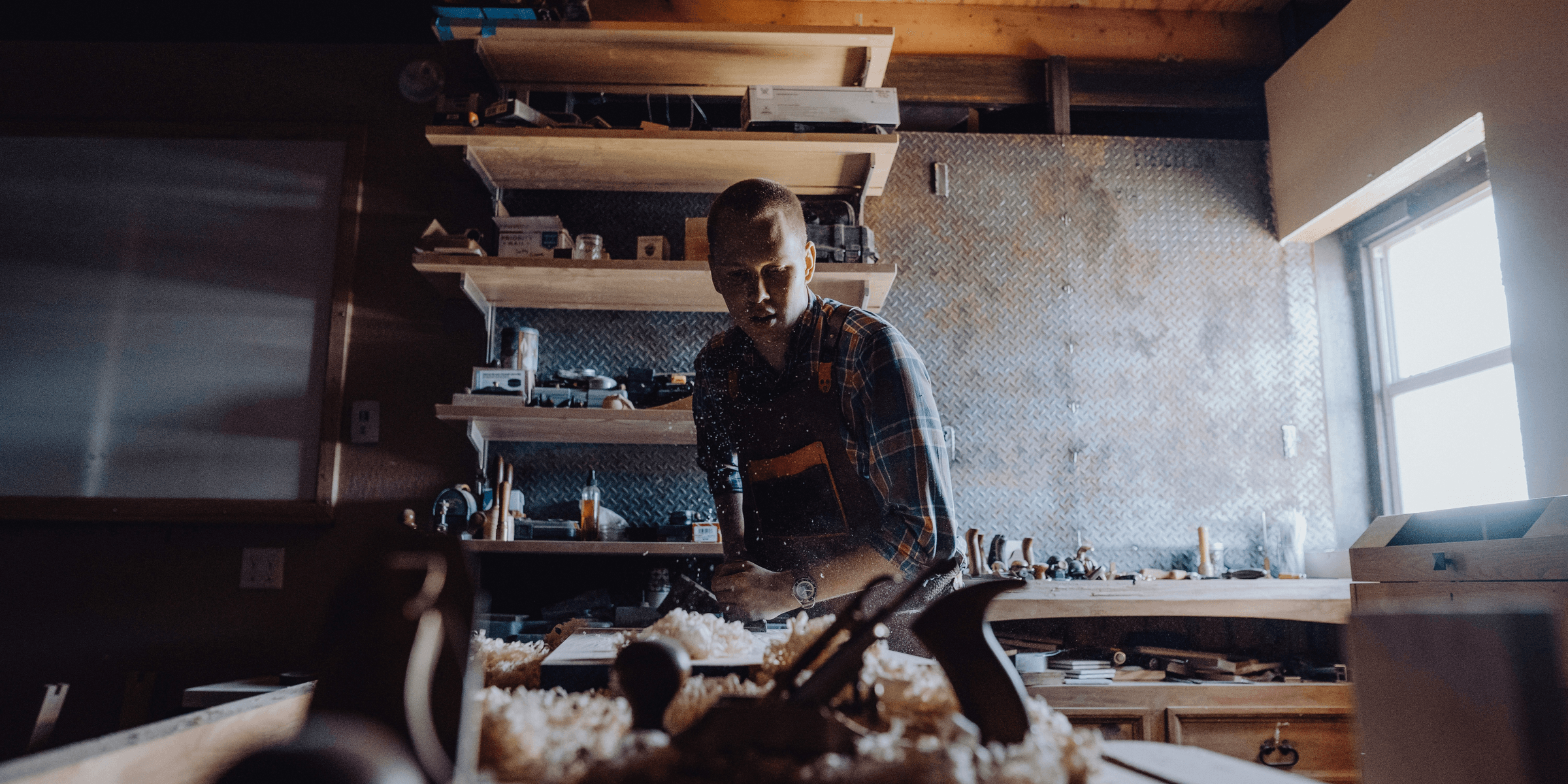 a man working in a woodworking shop.