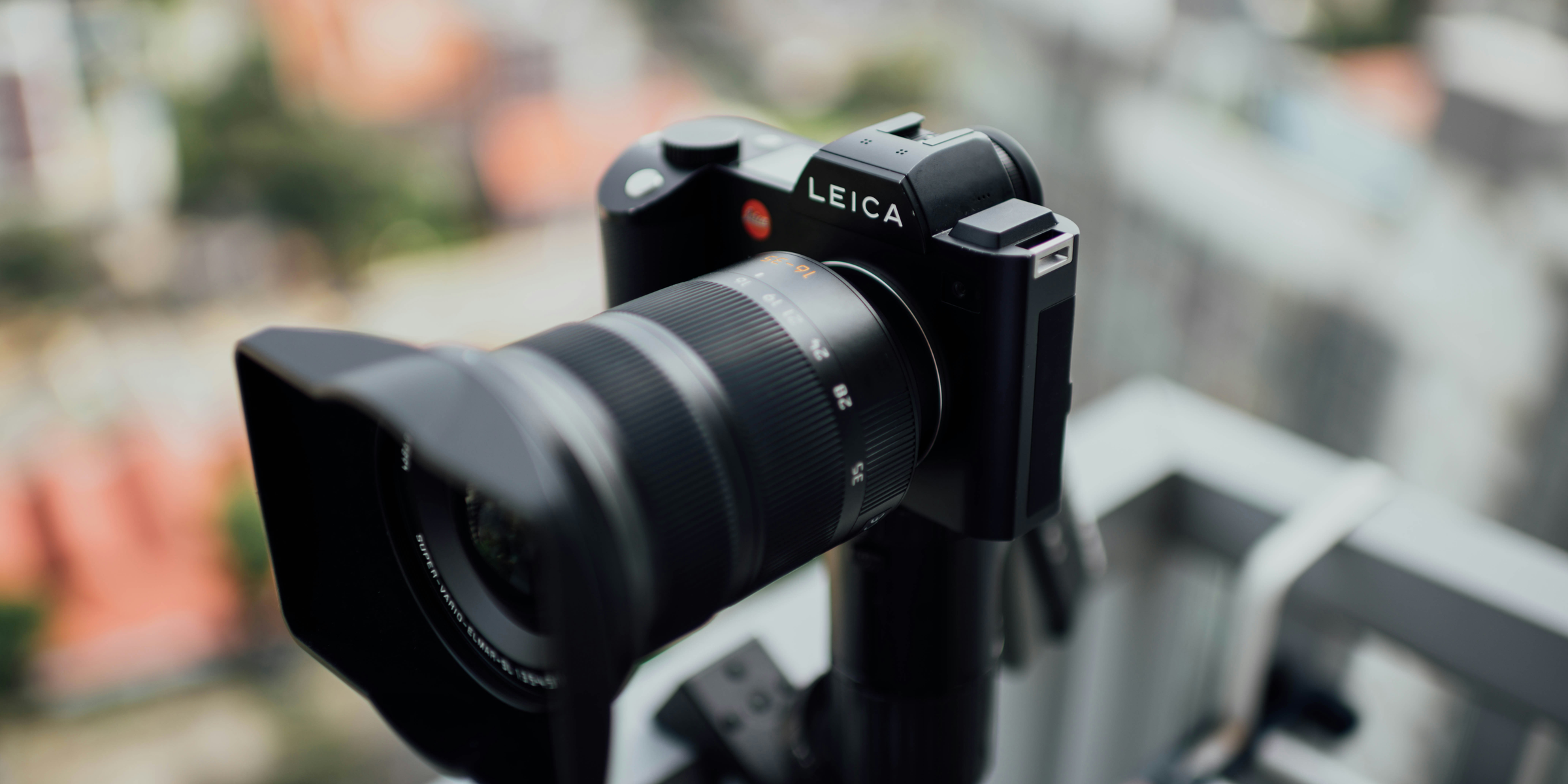 black Leica bridge camera.