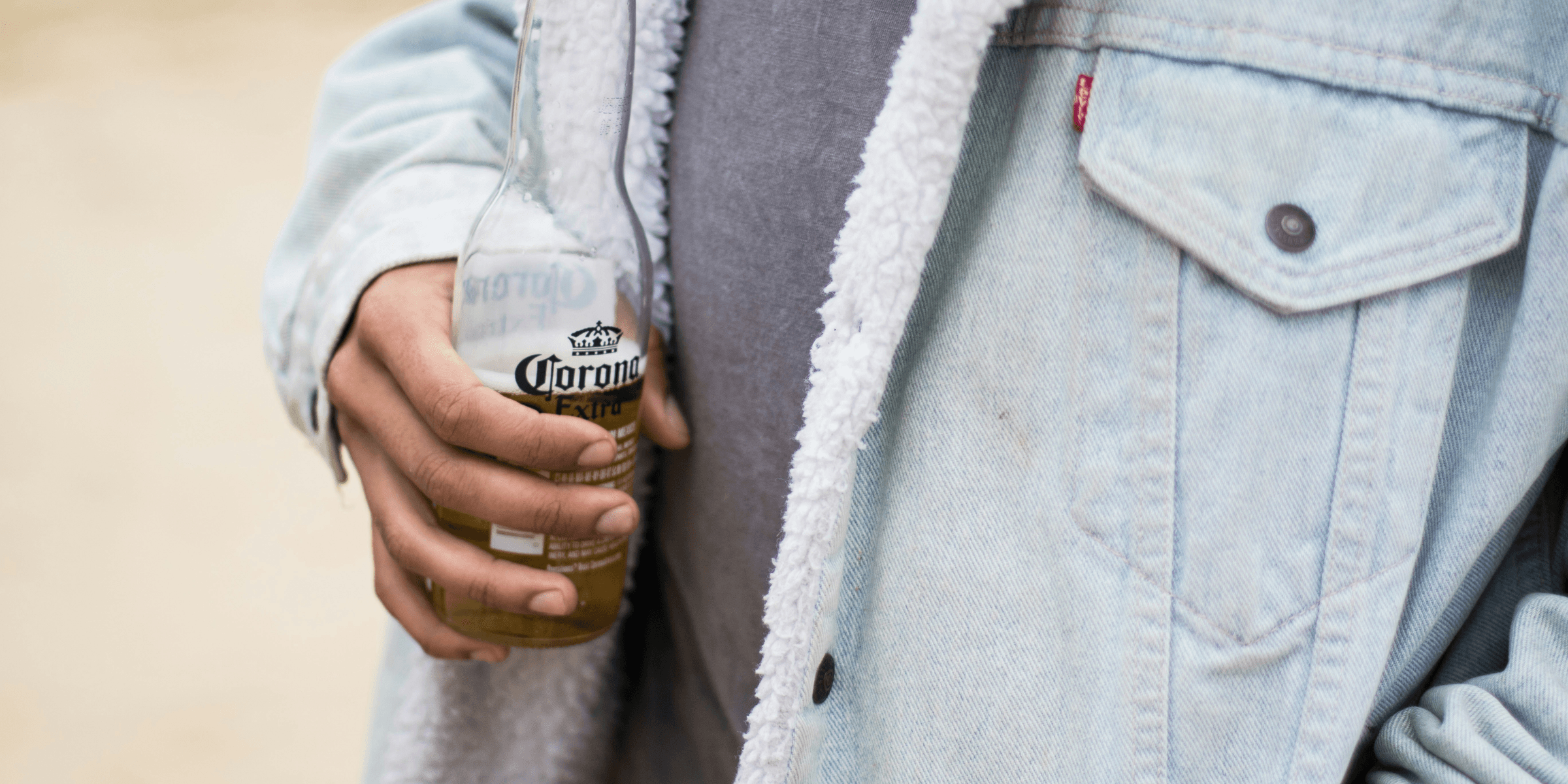 person wearing blue denim jacket.