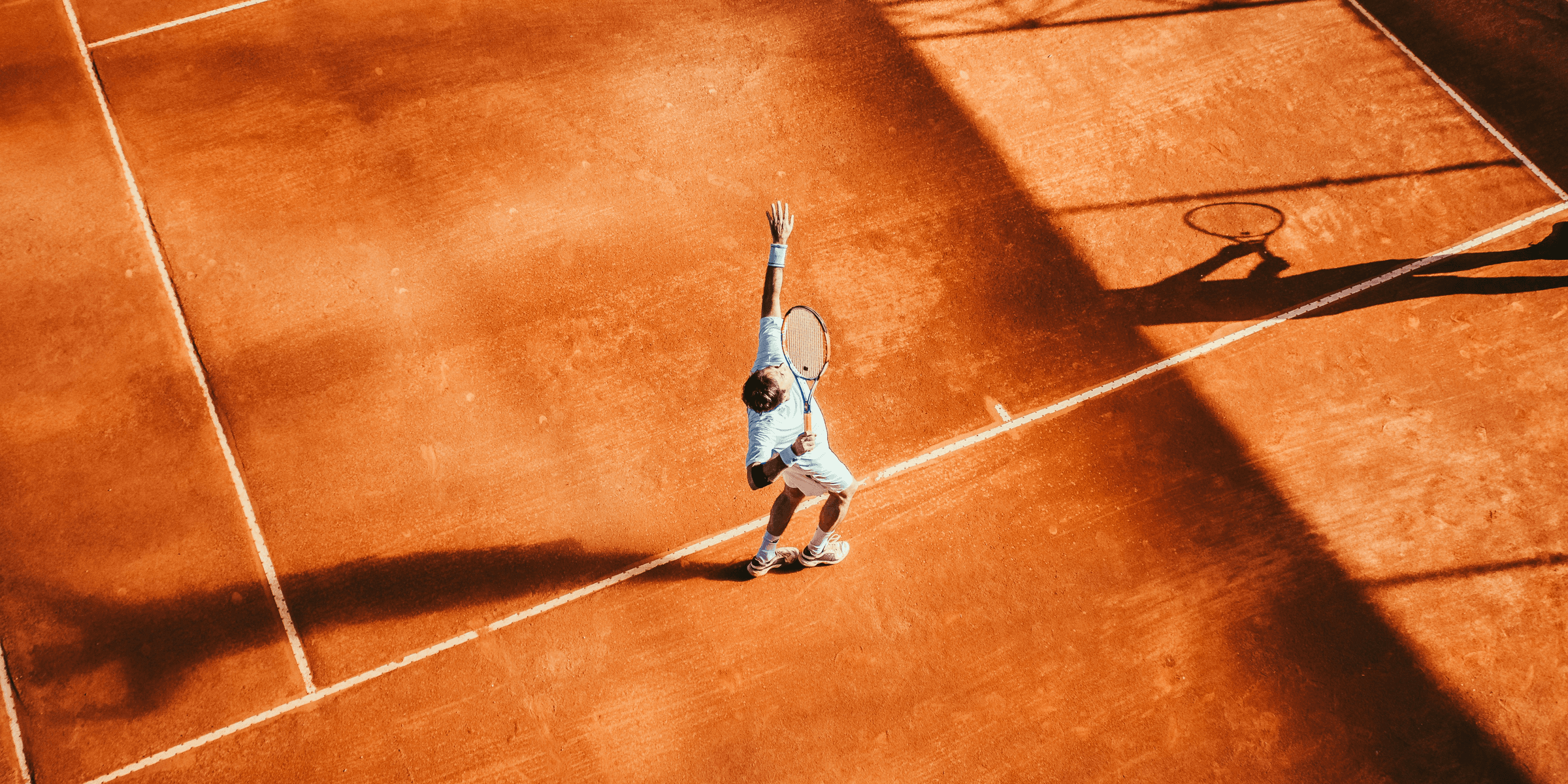 man playing tennis.