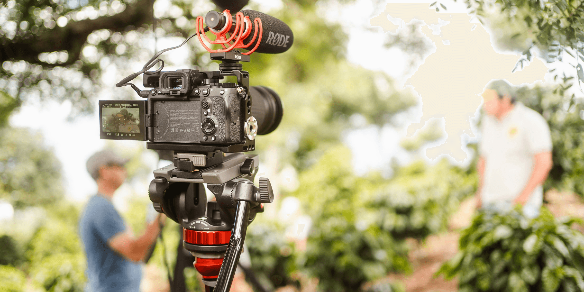 black dslr camera on tripod
