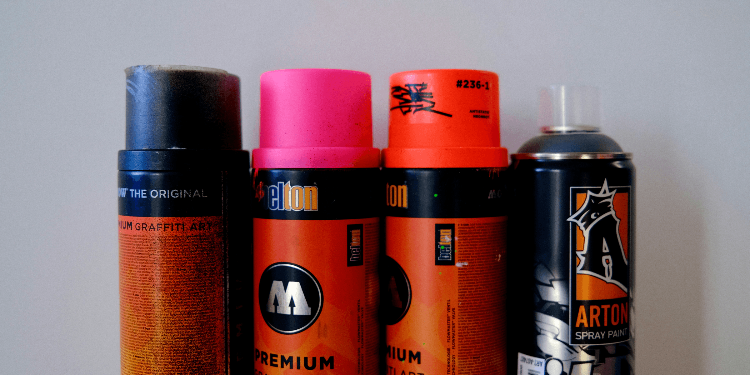 a group of different types of spray paint.