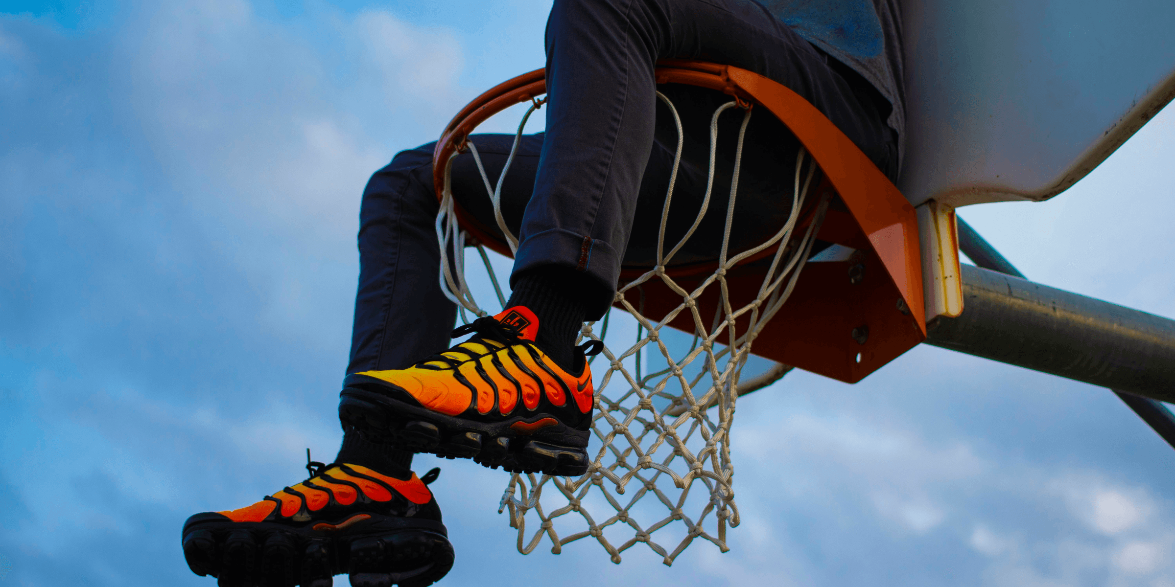 a basketball player dunking the ball into the hoop