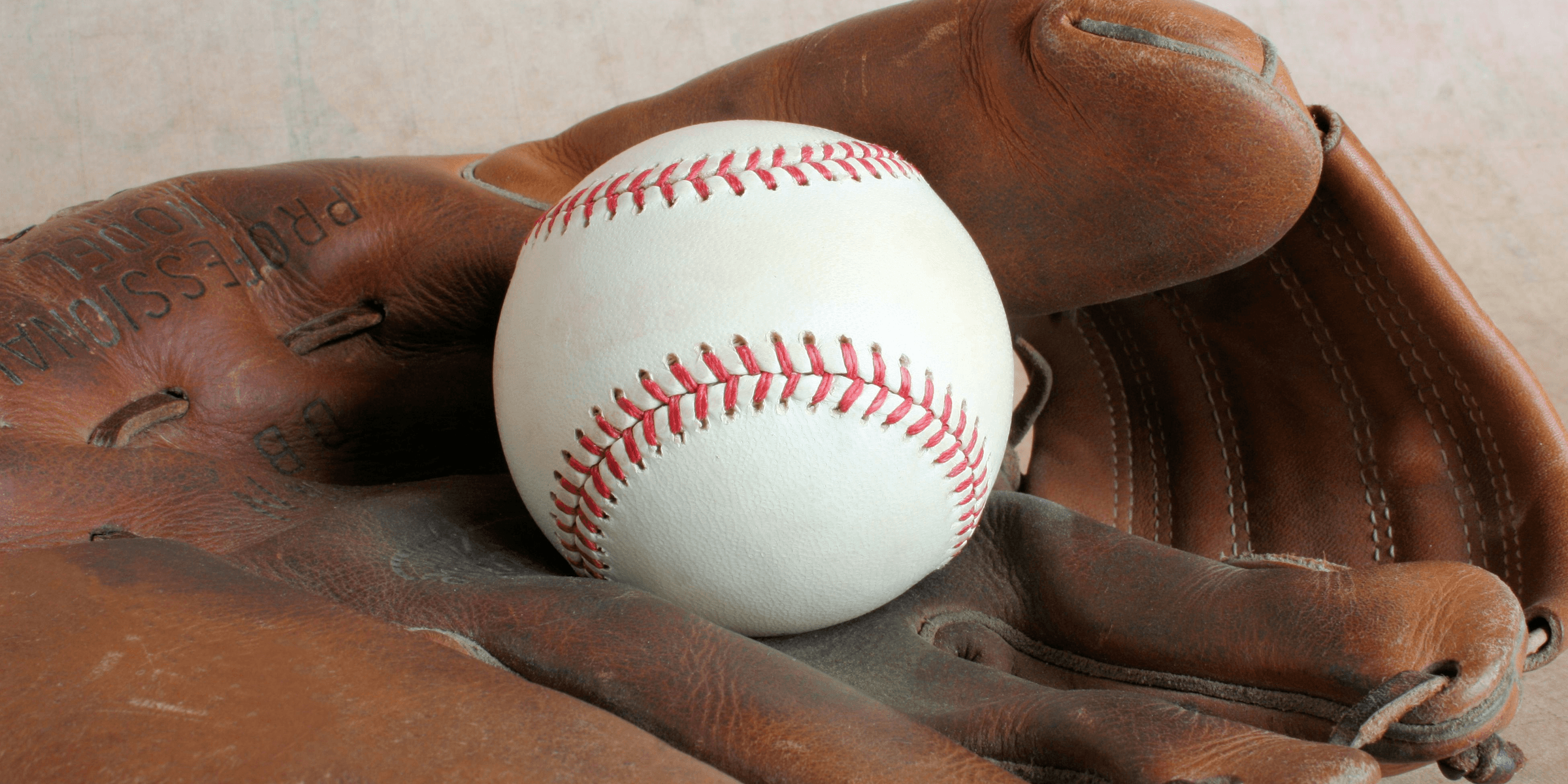 a baseball glove with a baseball in it.