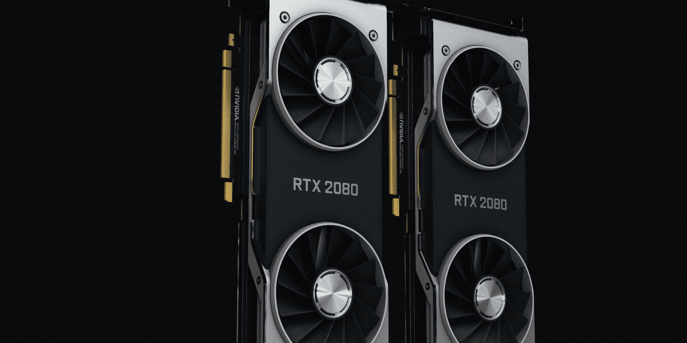 a pair of black and silver graphics cards