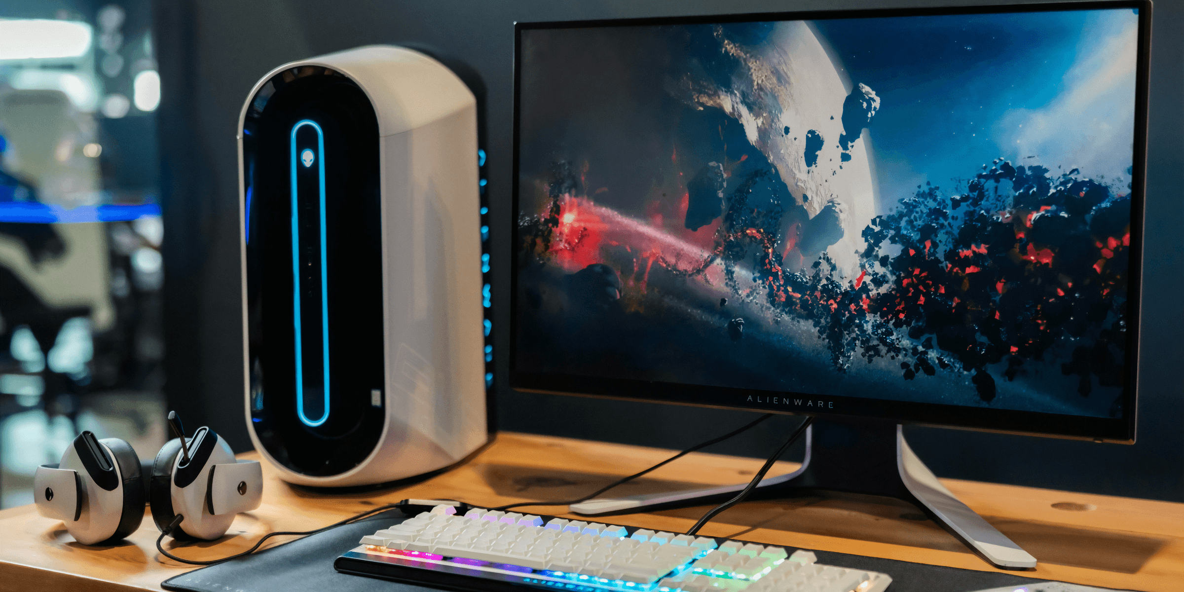 black flat screen computer monitor beside white computer keyboard.