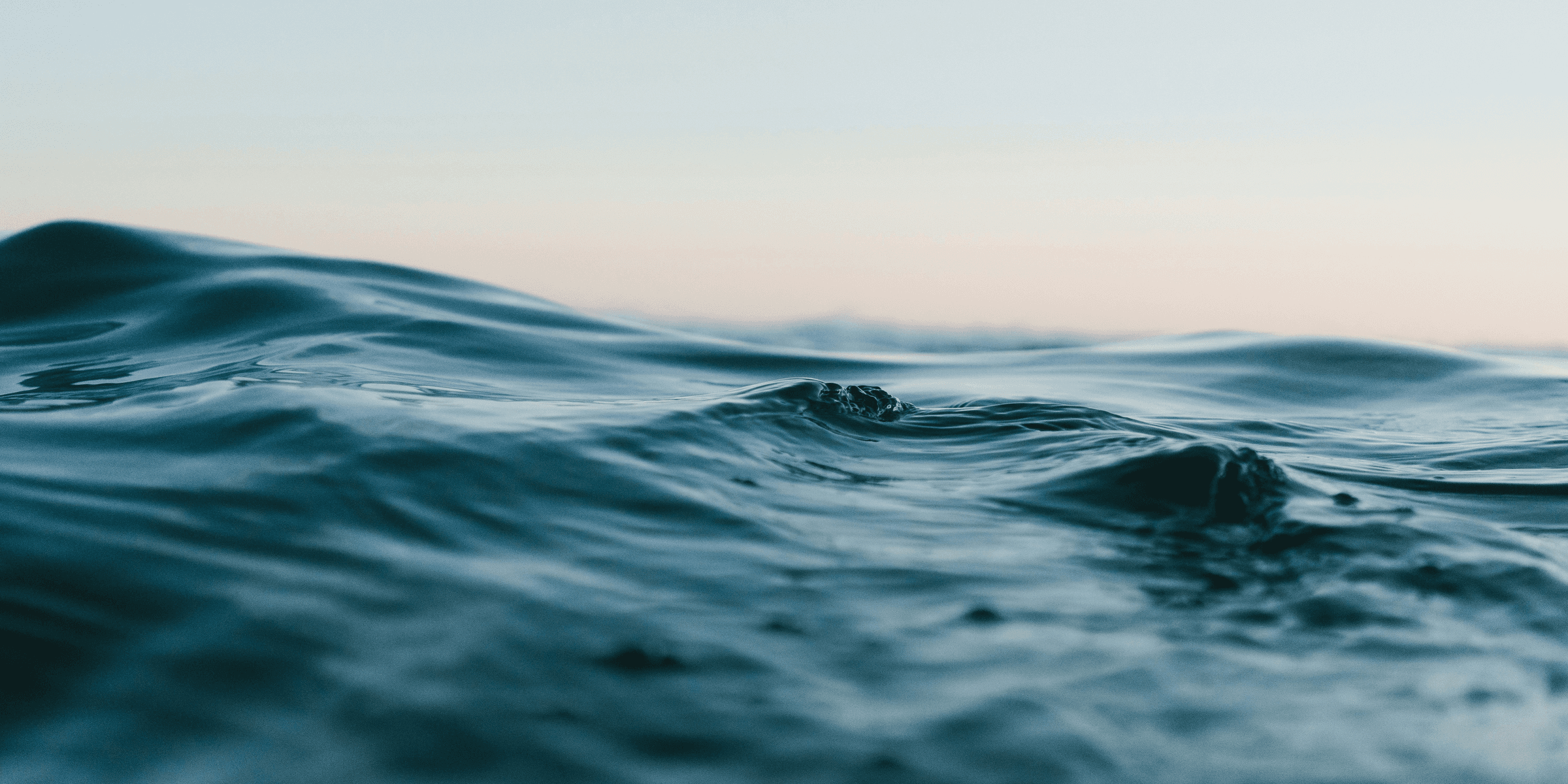 body of water under sky