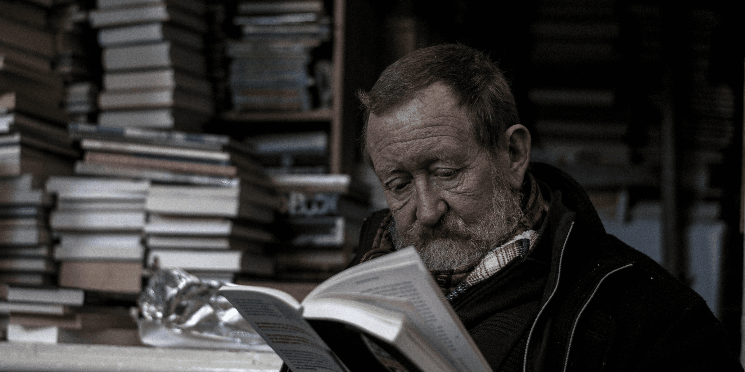 man reading a books.