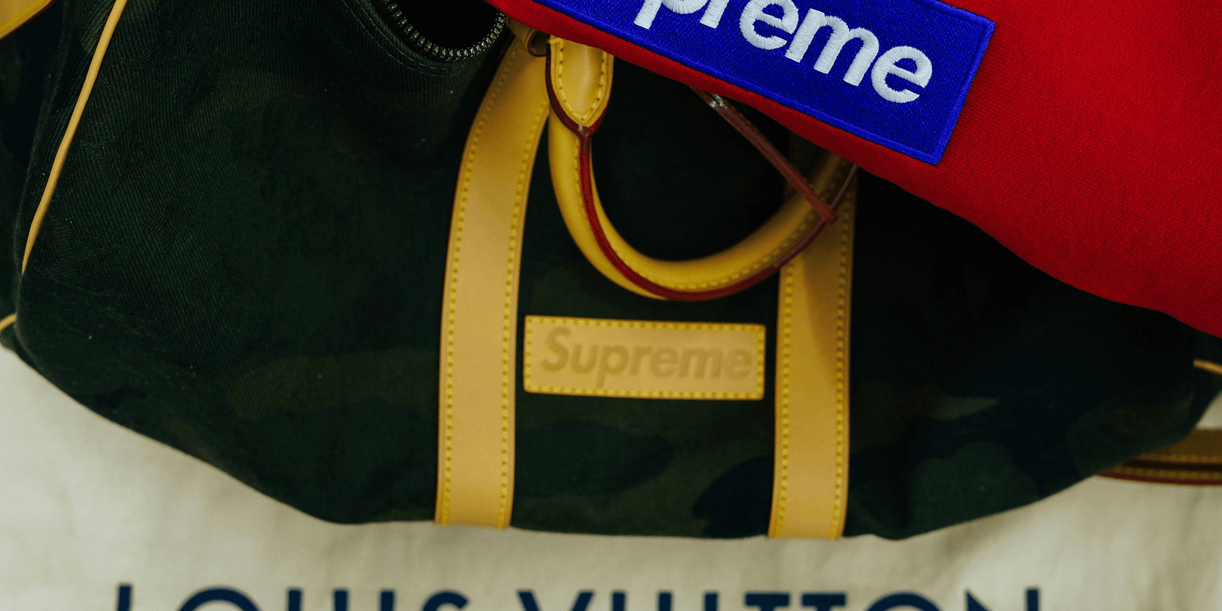 black Supreme handbag.