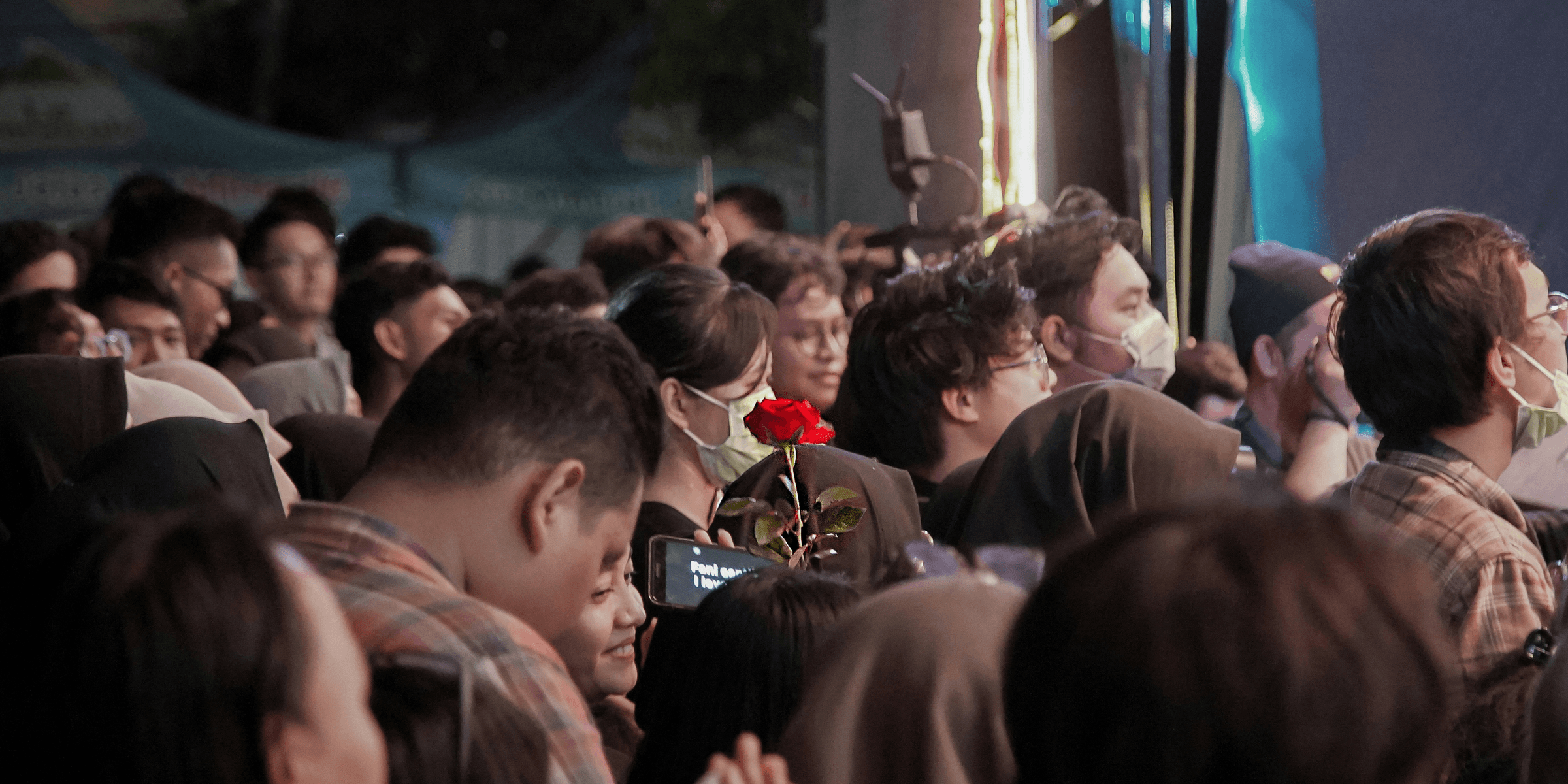 people gathering in a concert during night time.