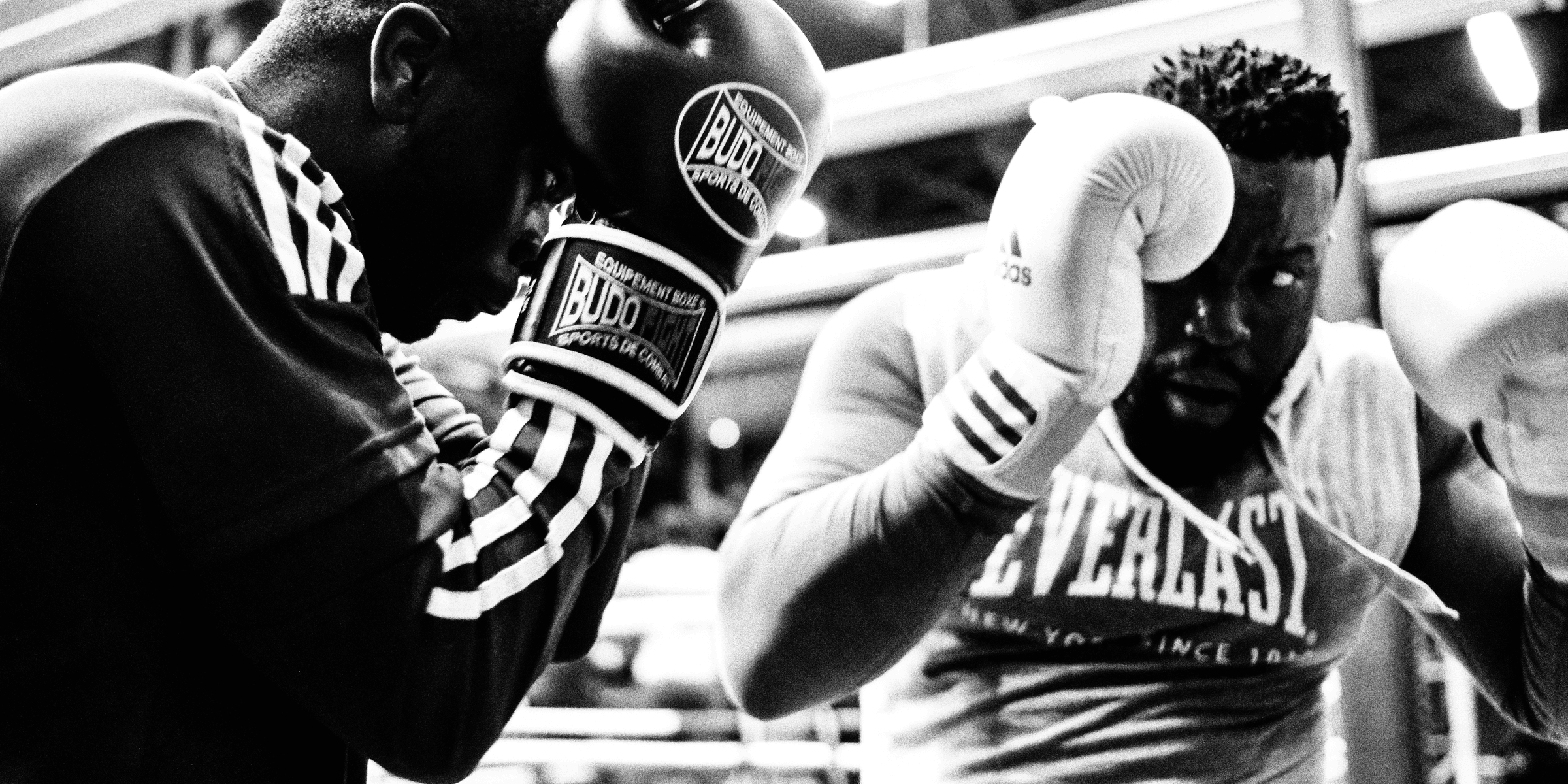 two men wearing boxing gloves.