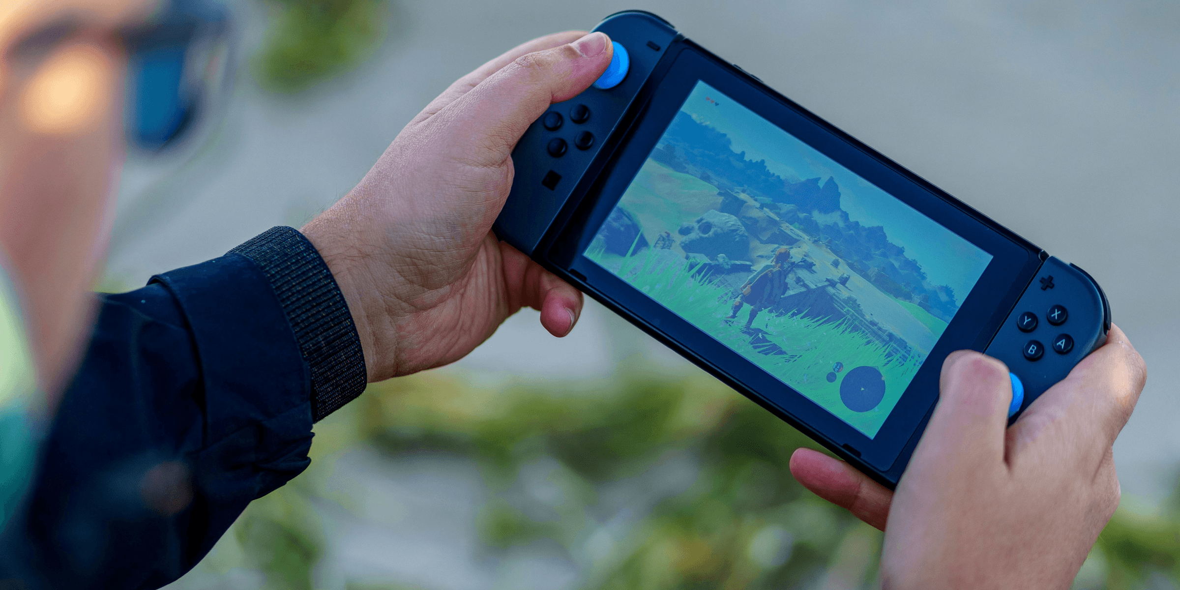 a person is playing a video game on a cell phone.