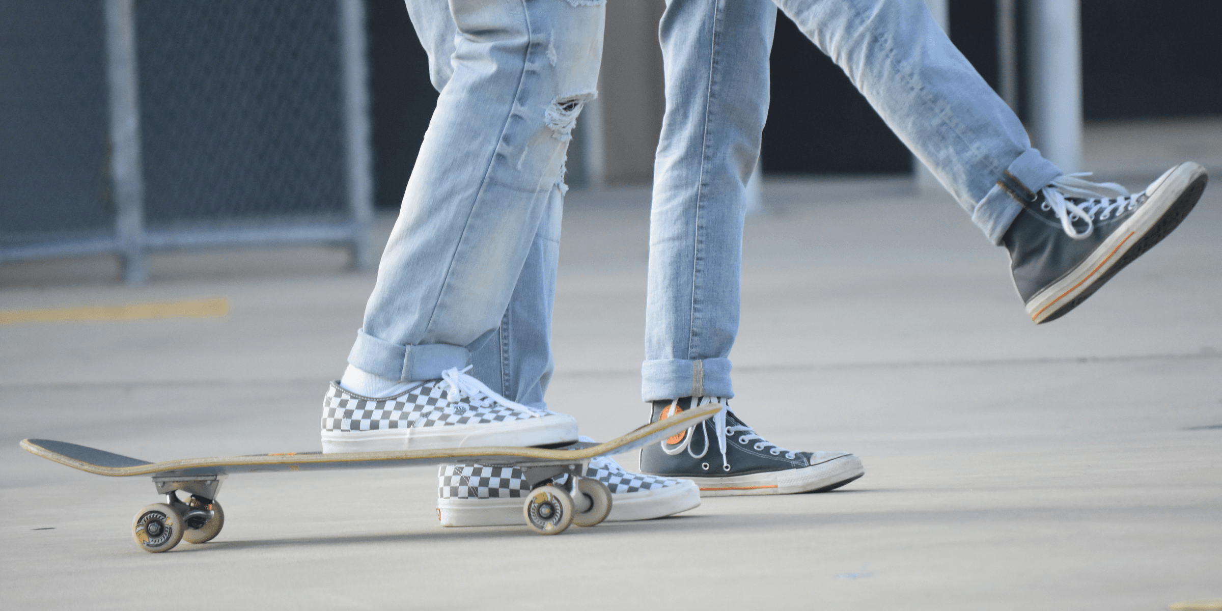 person in blue denim jeans and blue and white sneakers