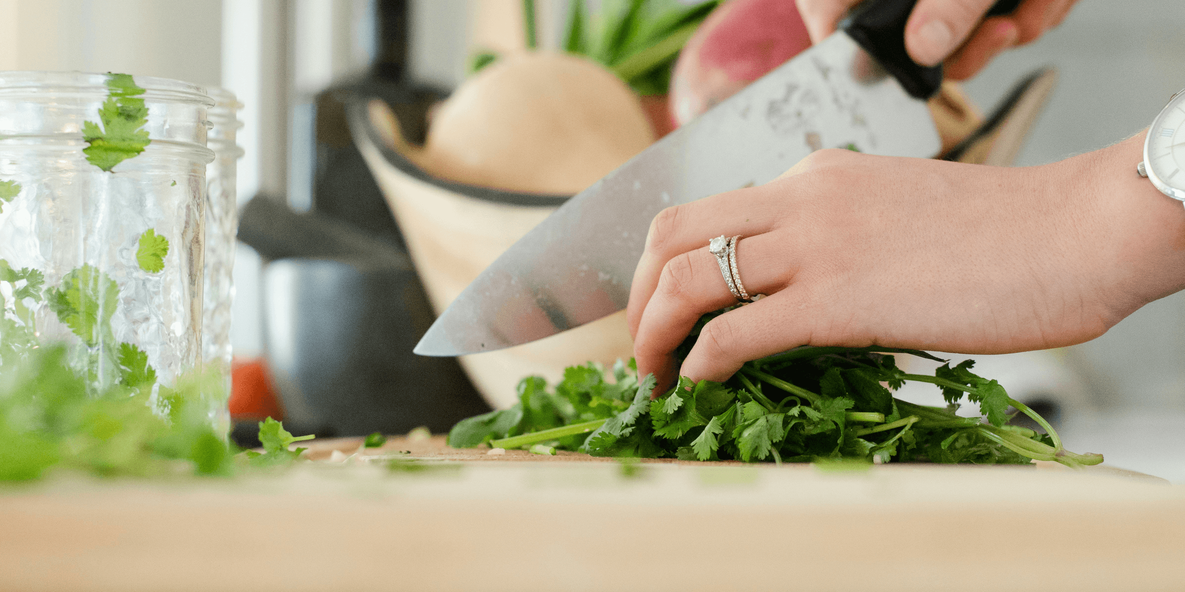 person cutting vegetables with knife.