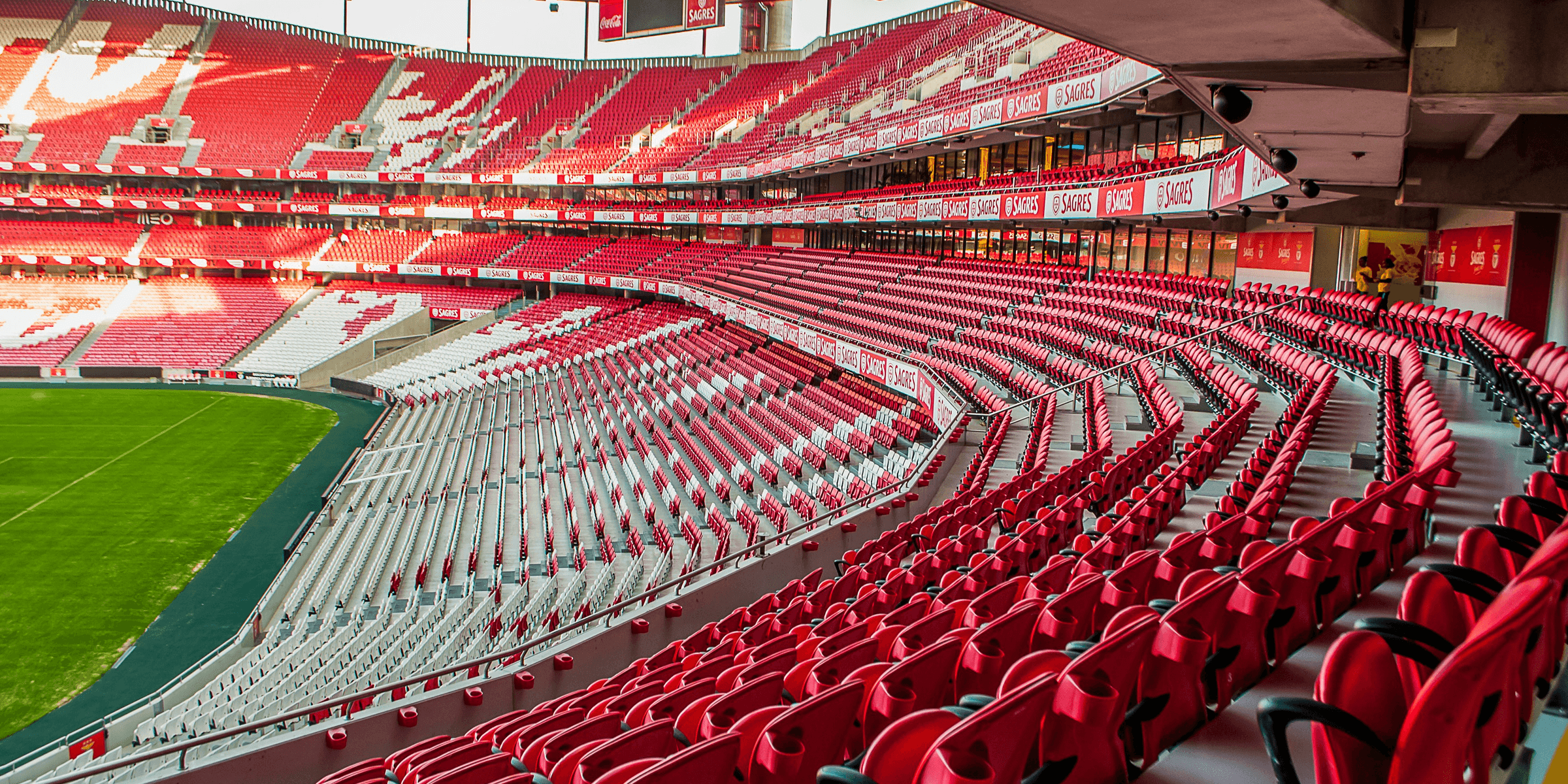 white and red stadium photo at daytime.