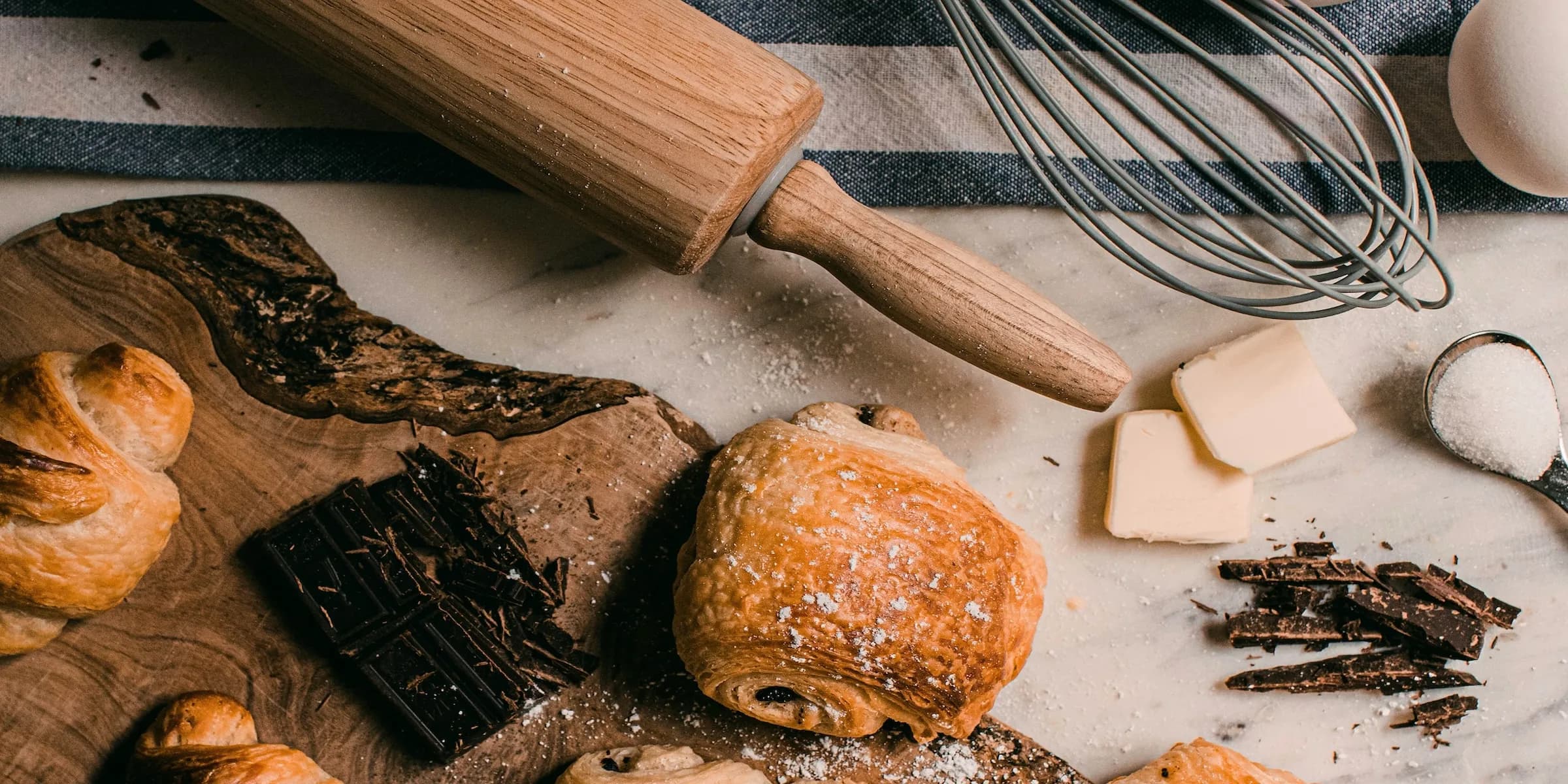 a group of people in a kitchen preparing food