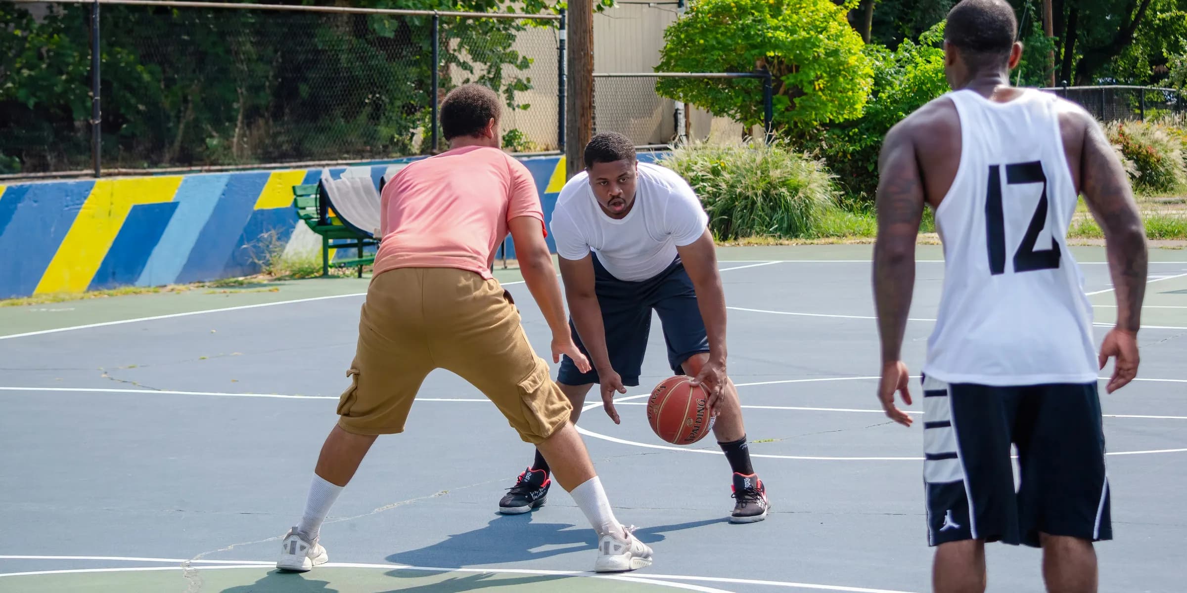 a group of men playing a game of basketball