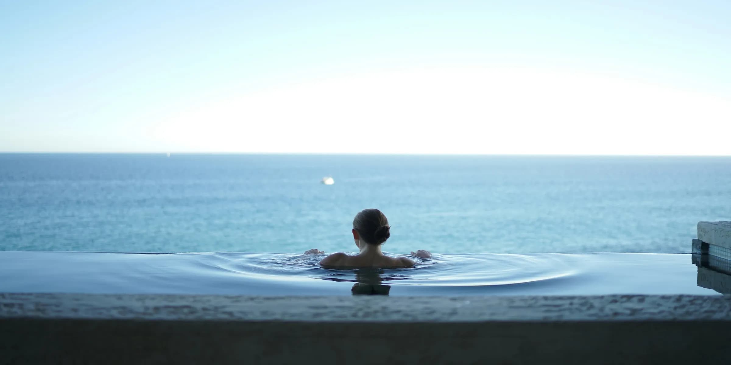 woman in a bathtub on a balcony