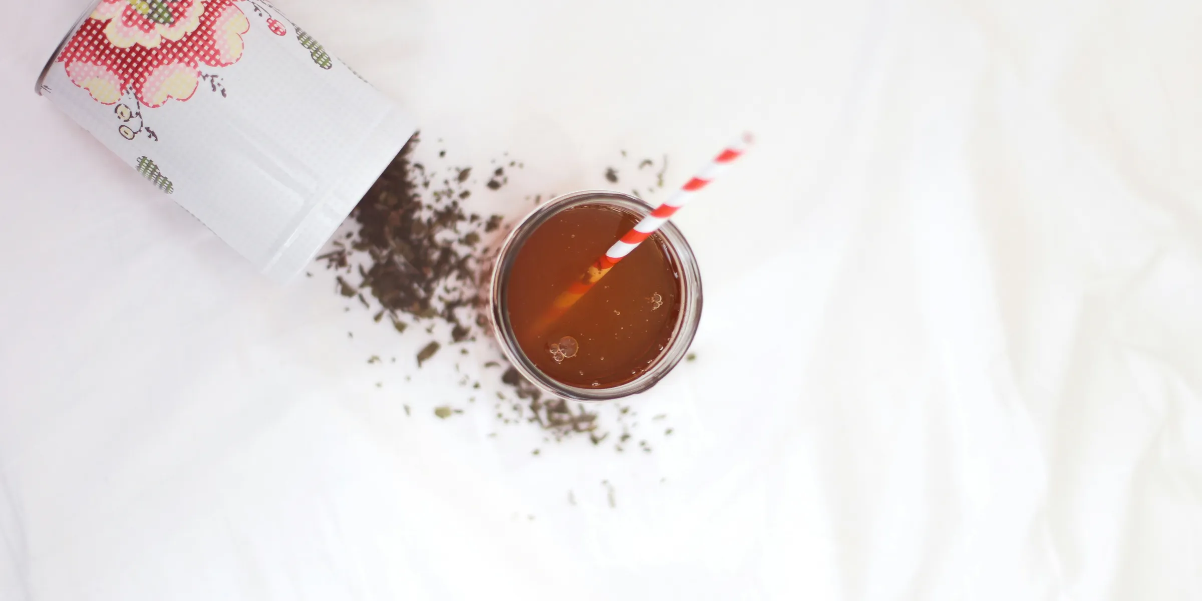 brown liquid with red and white straw