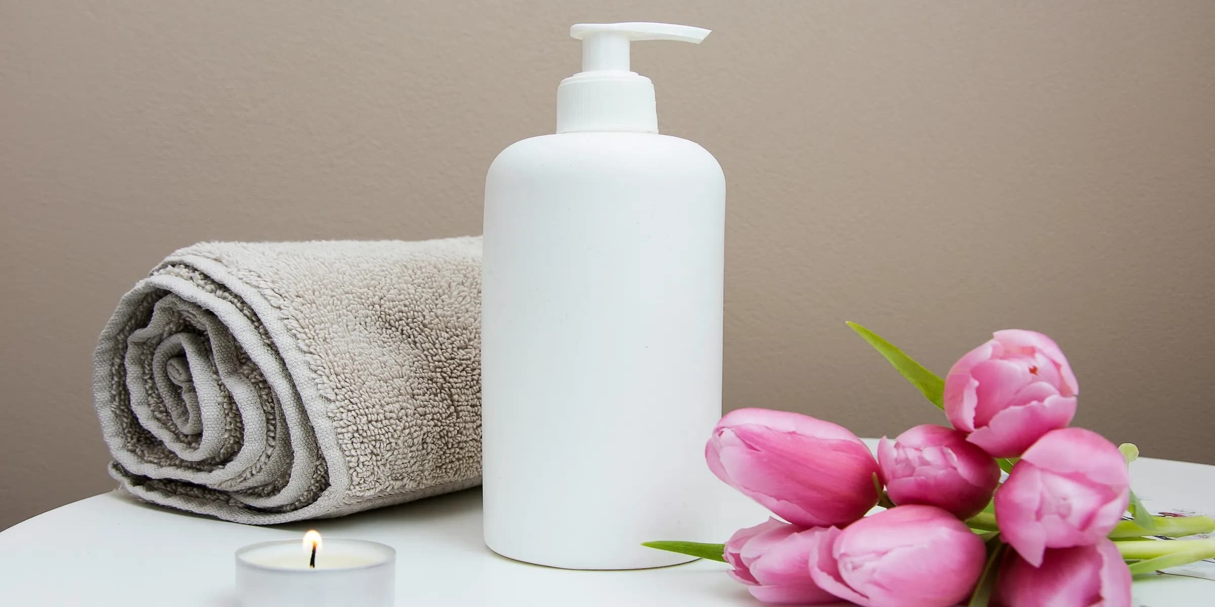 soap with towel and flowers on a table