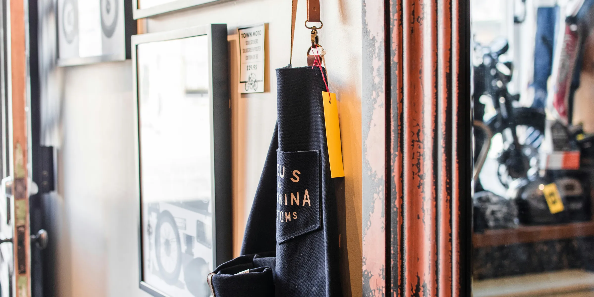 black and brown bag hanged beside wall
