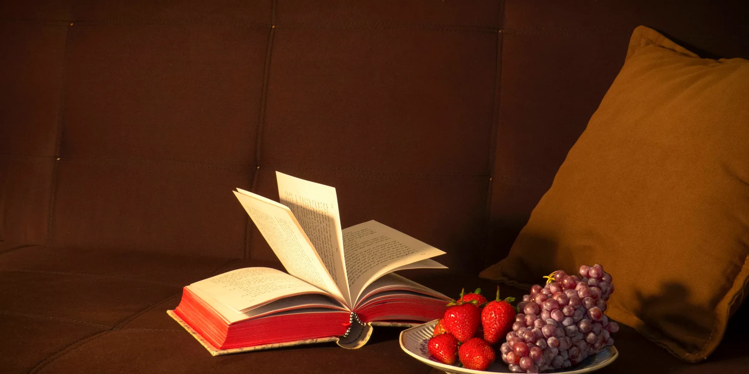 strawberries and grapes on white plate