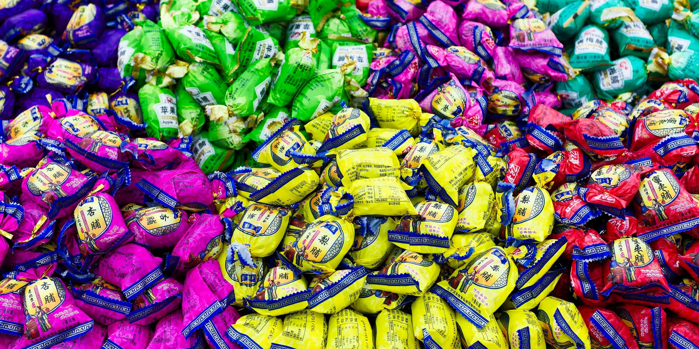 A large pile of colorful candies sitting on top of a table