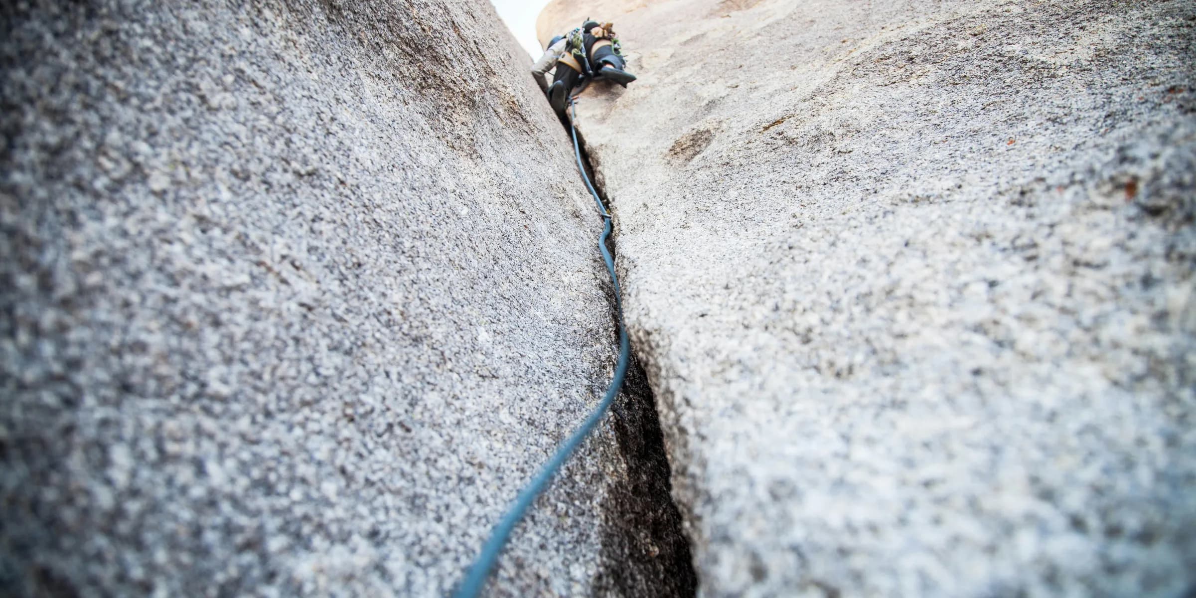 person rock climbing