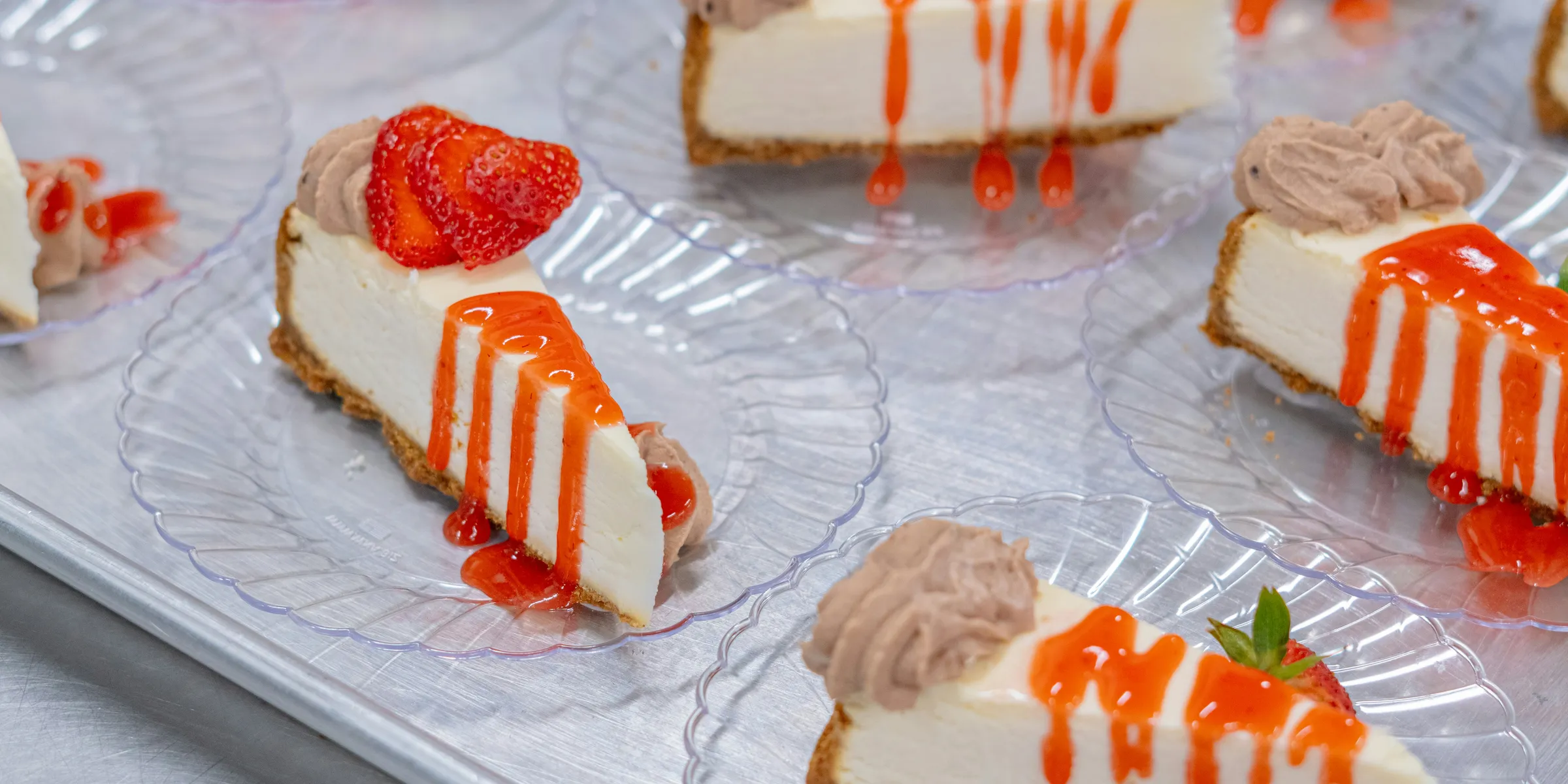 Delicious cheesecake slices with toppings and drizzles.