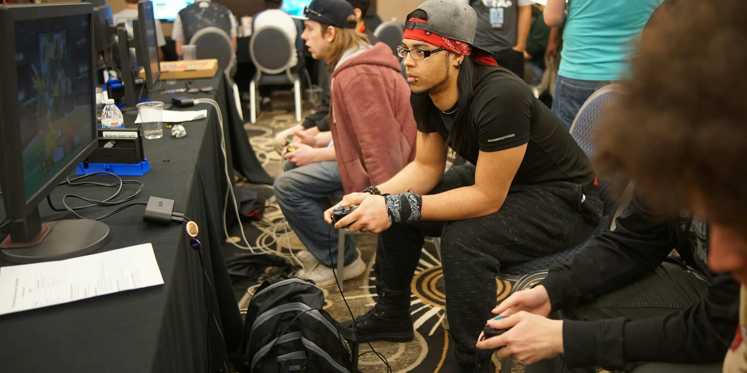 man sitting on chair playing games