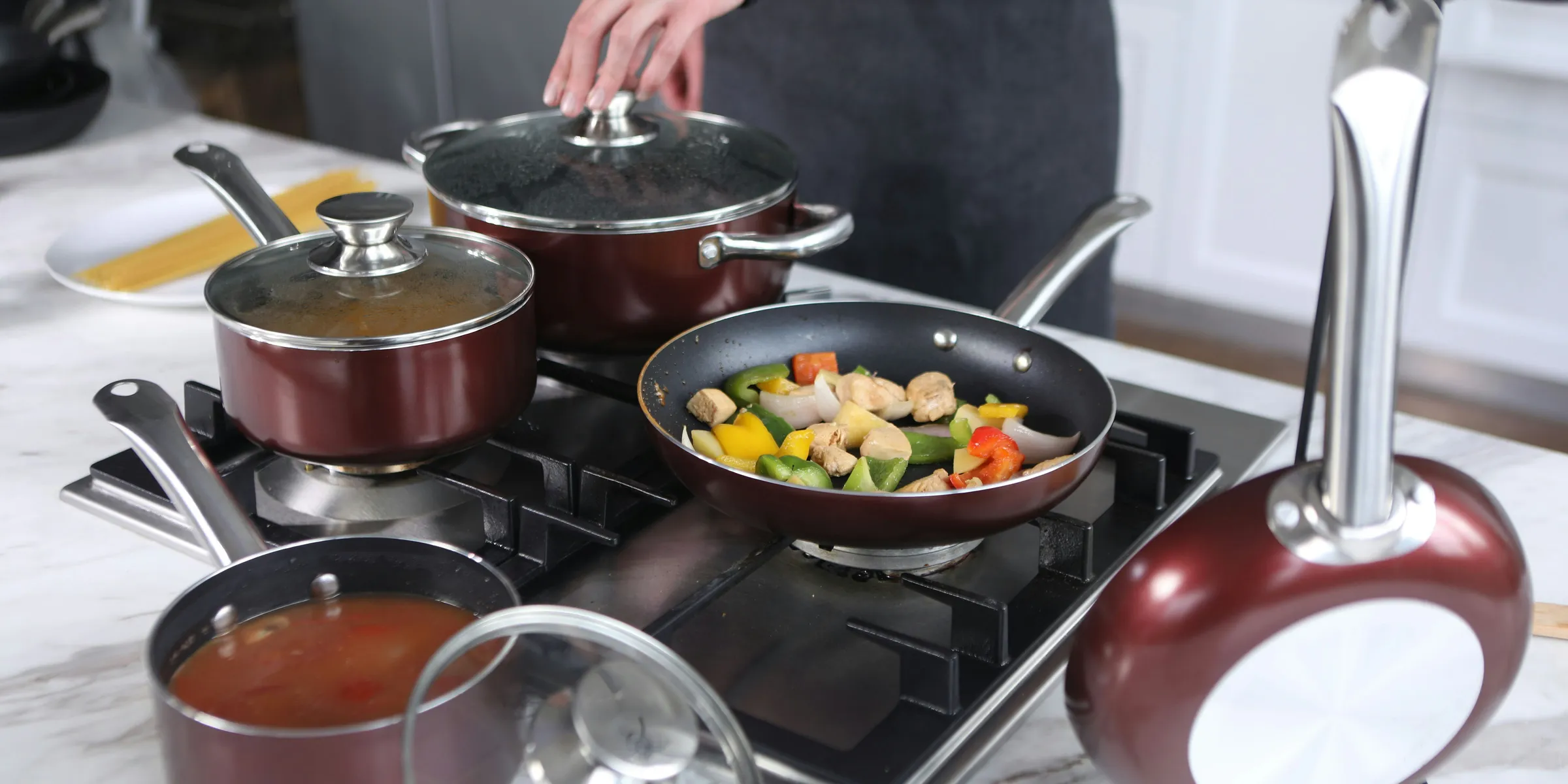 person cooking on stainless steel cooking pot