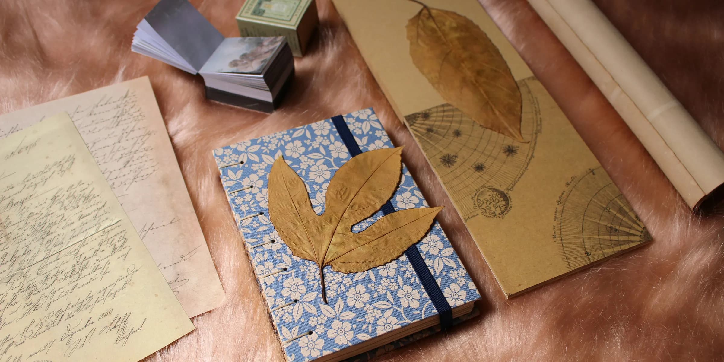 a table topped with lots of books and papers