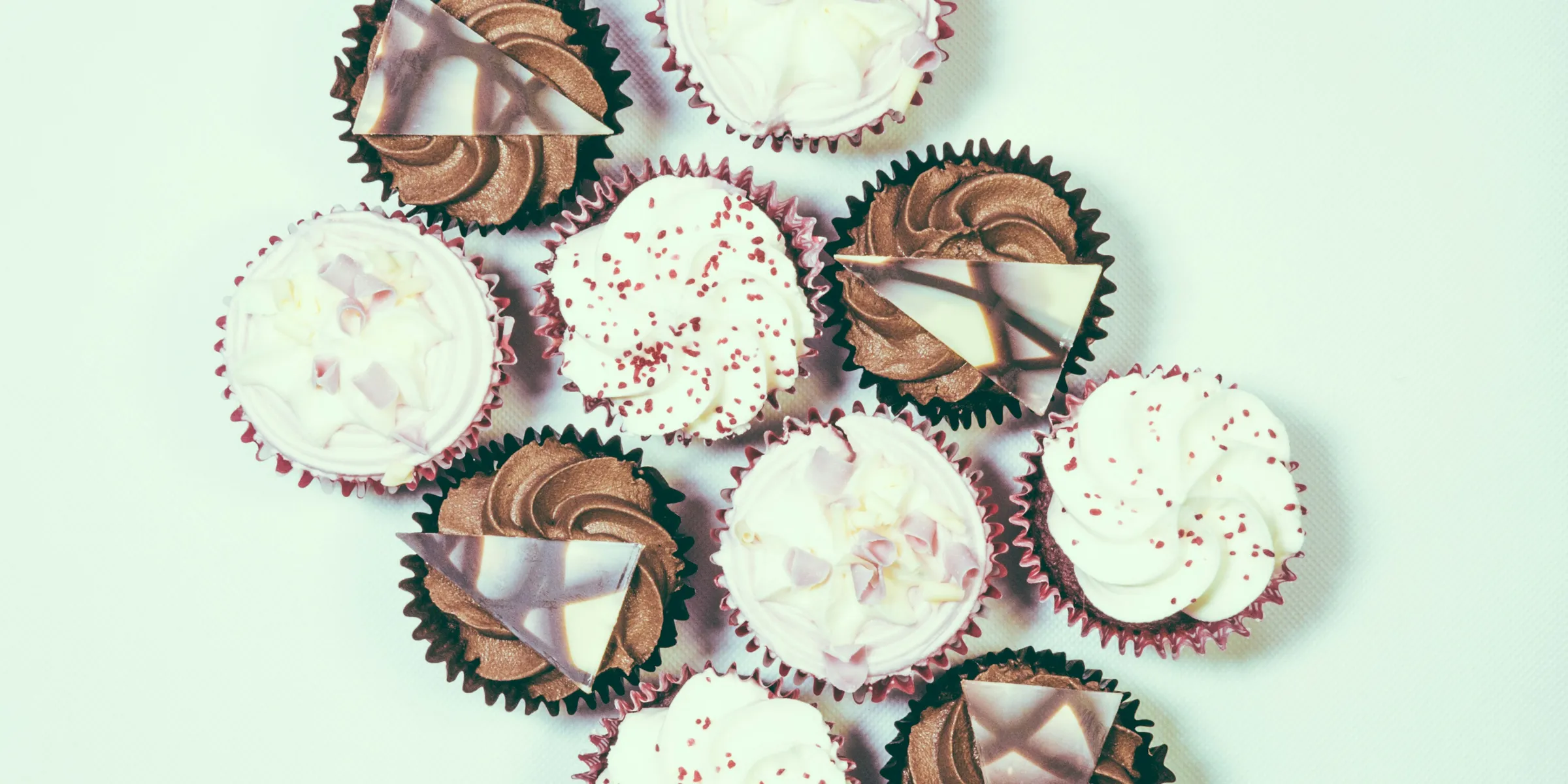 assorted cupcake lot on white surface