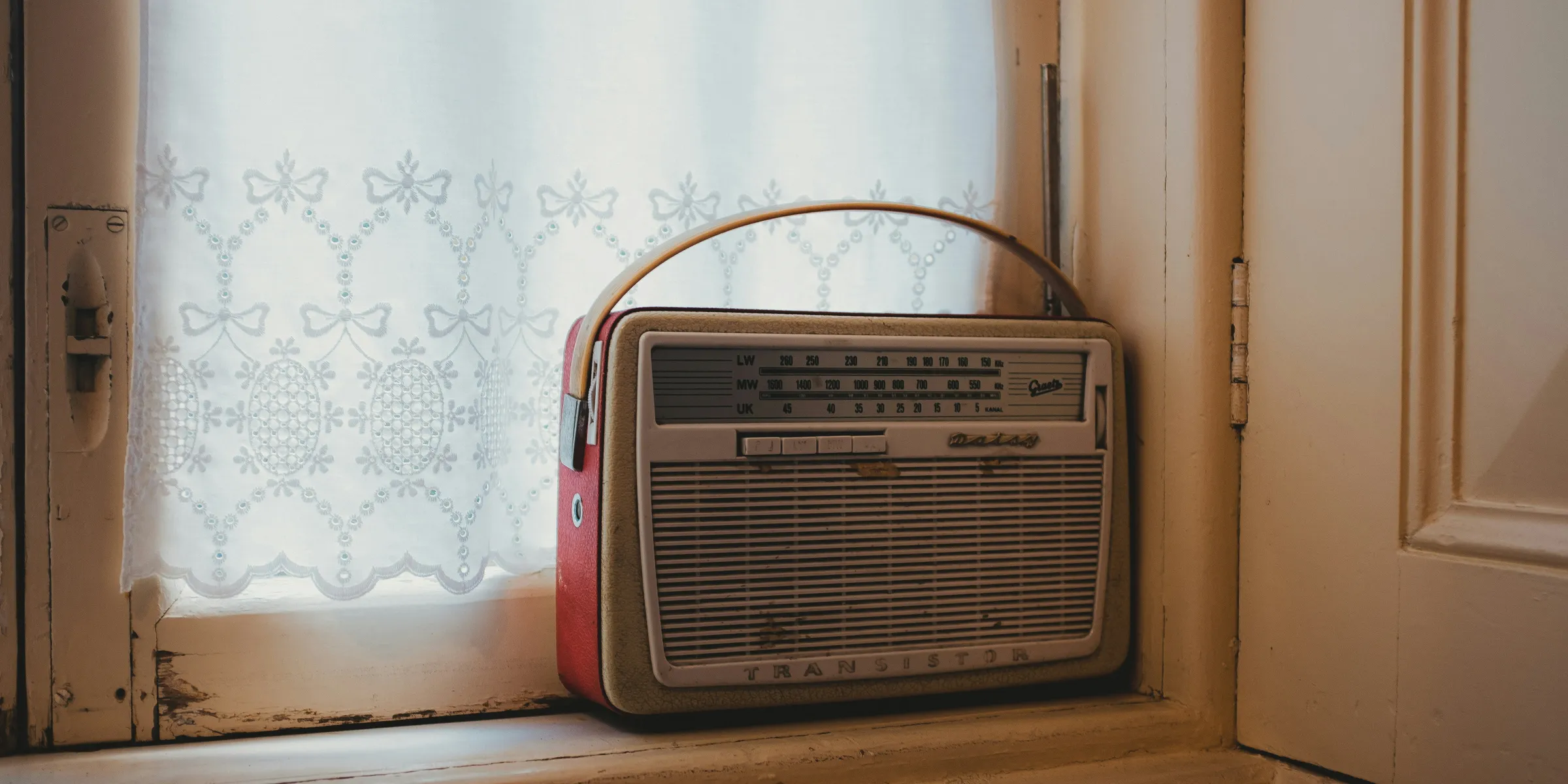 a radio sitting on top of a window sill