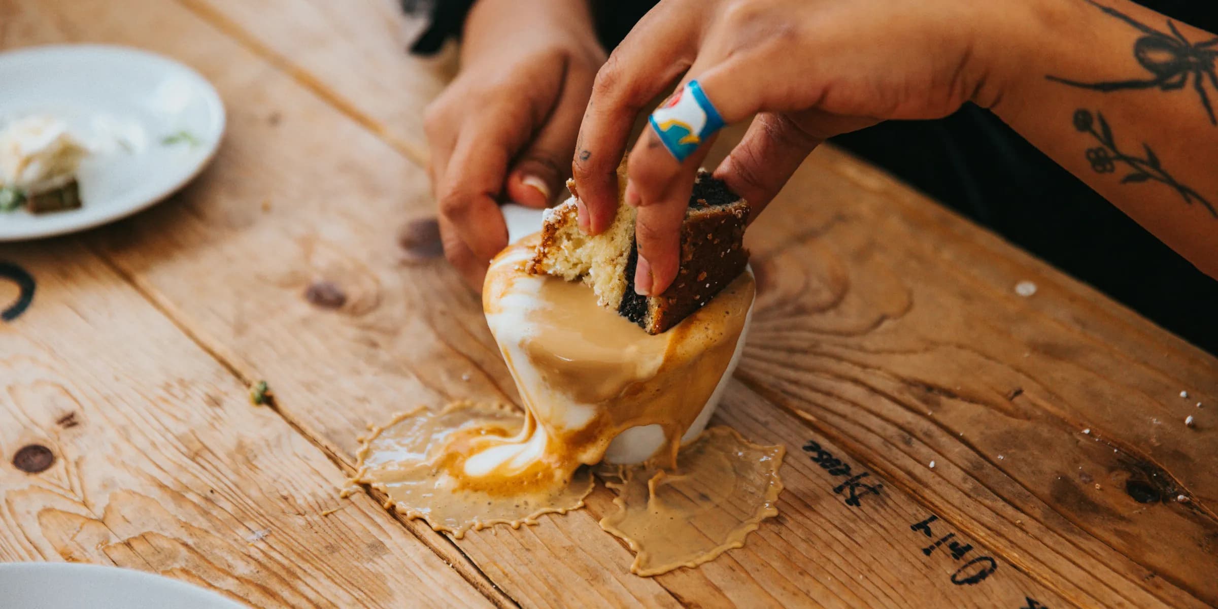 a person sitting at a table with food in front of them