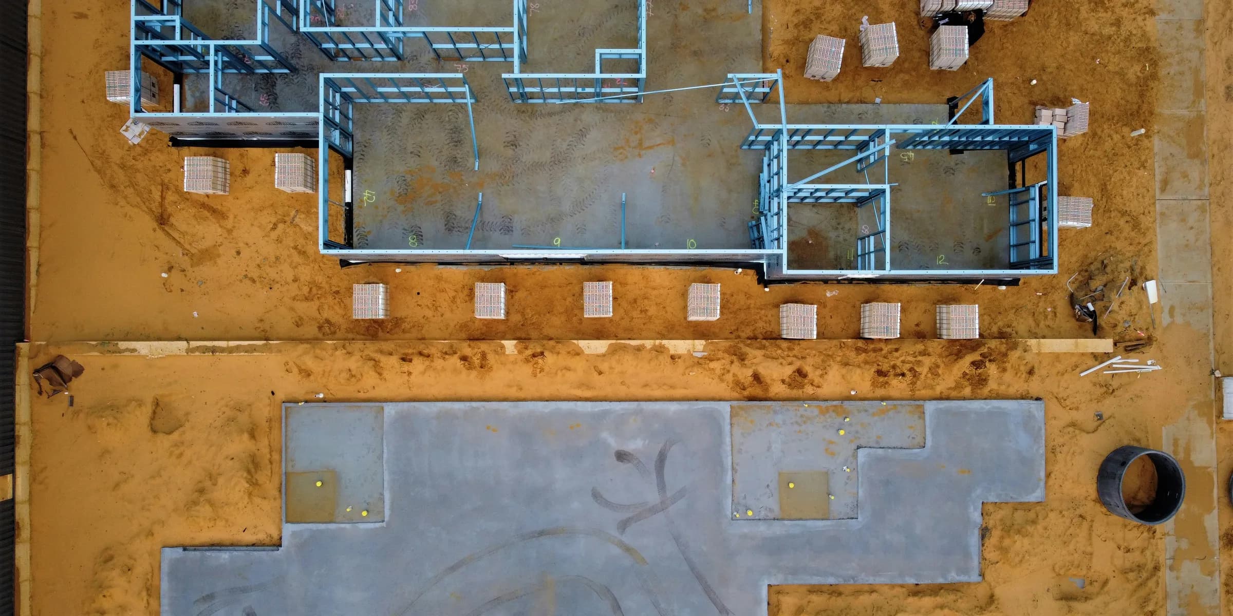 an aerial view of a construction site with concrete blocks