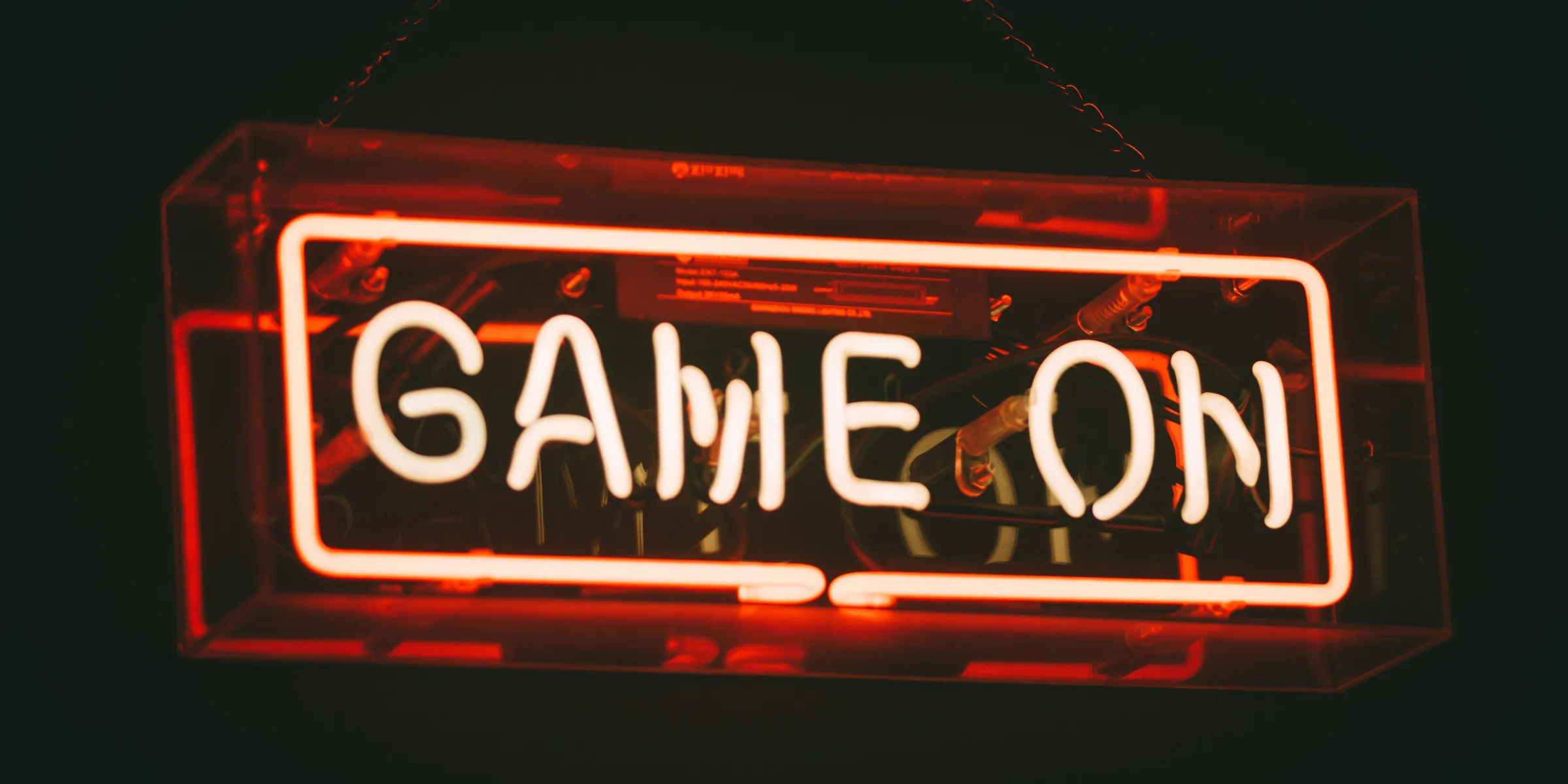 red and white Game On LED signage
