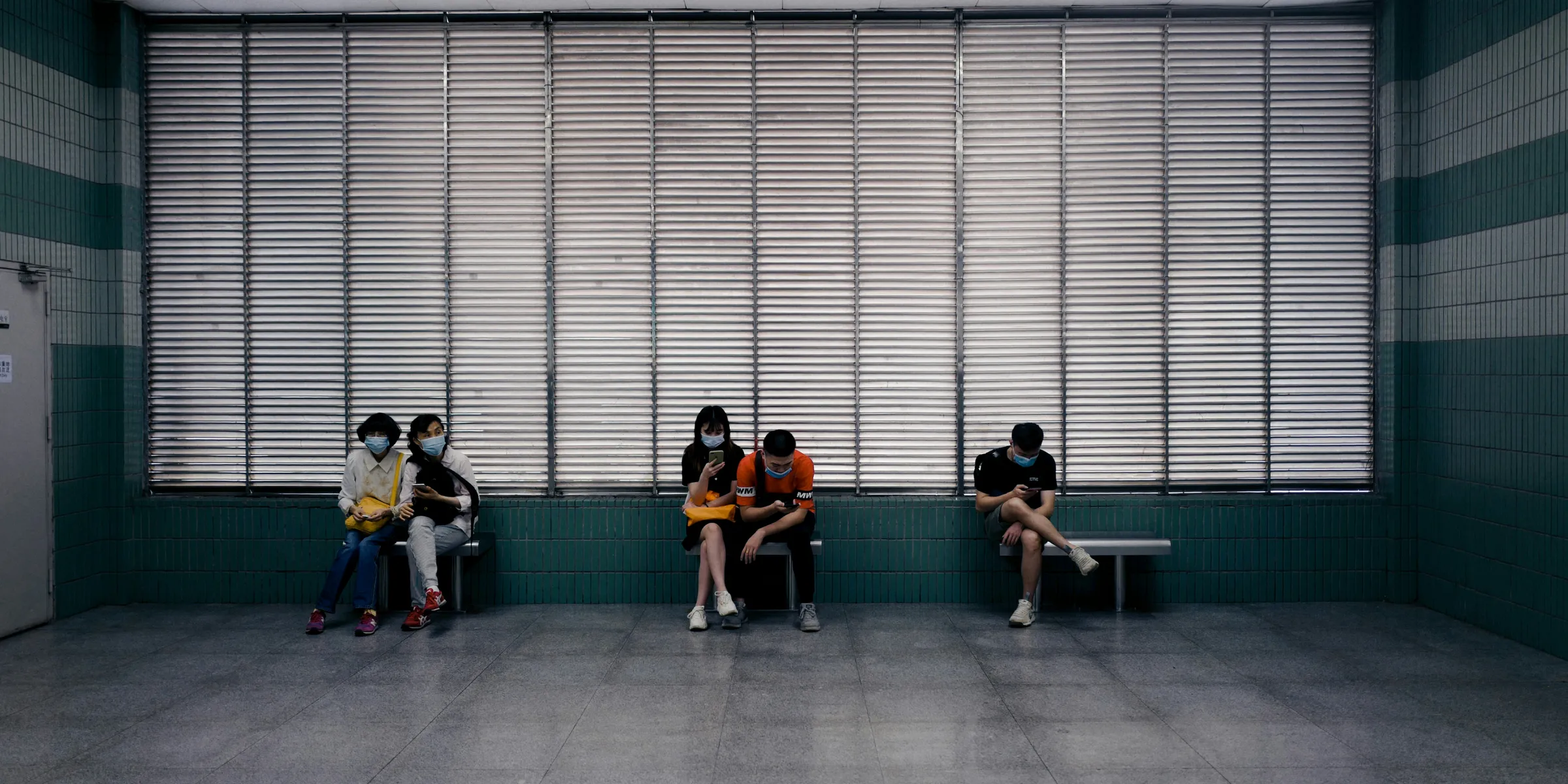 people sitting on green chairs