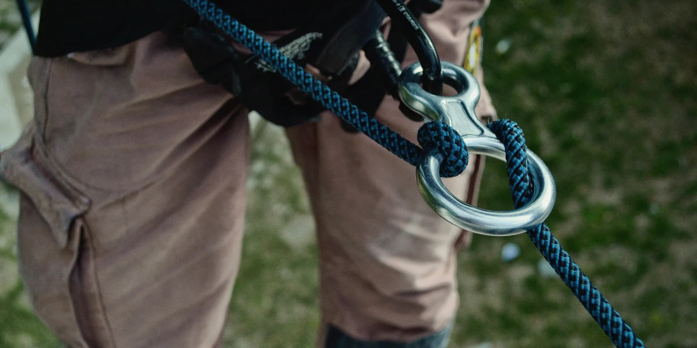 person with blue safety harness on focus photo