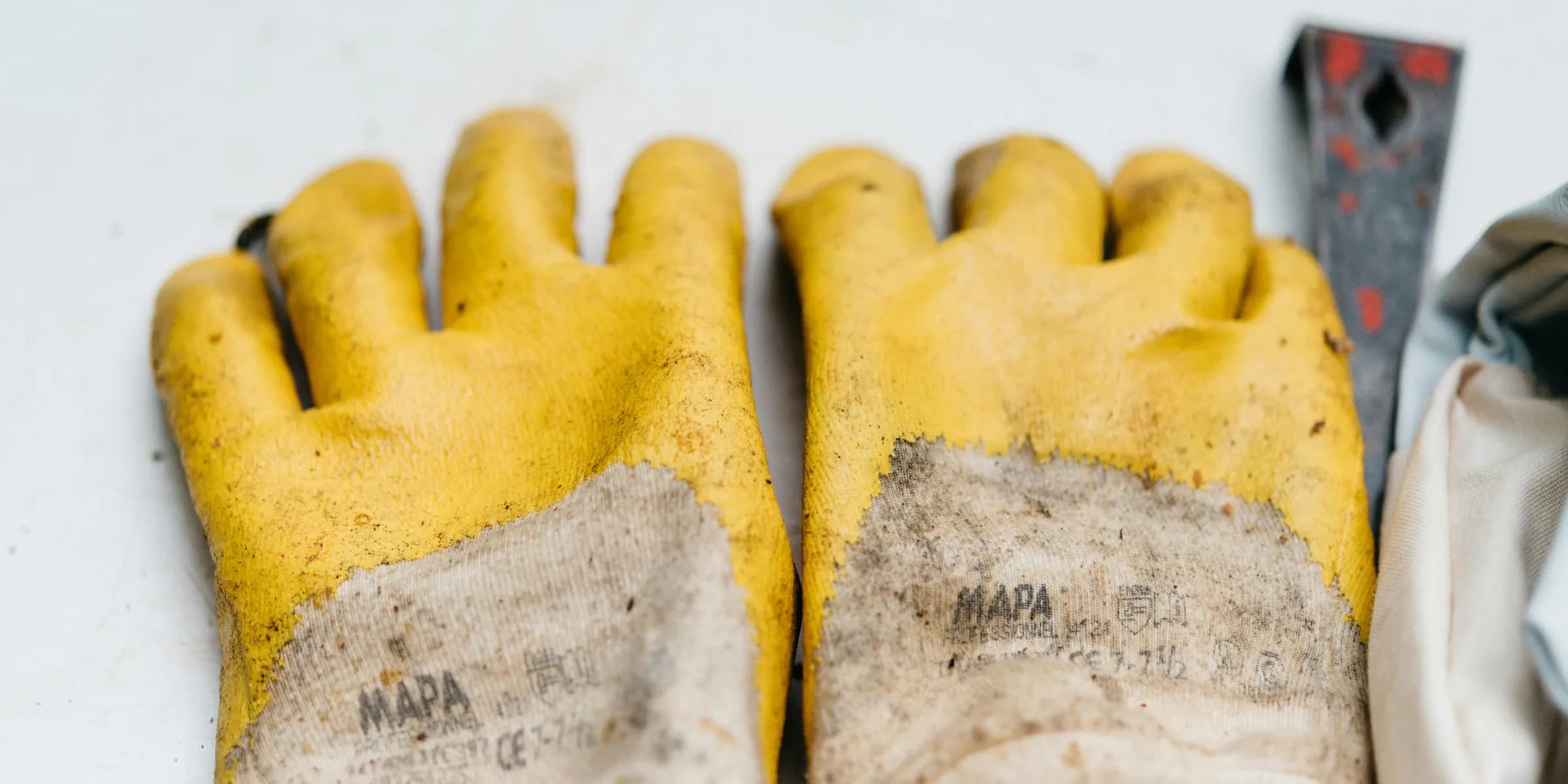 pair of brown-and-yellow leather gloves
